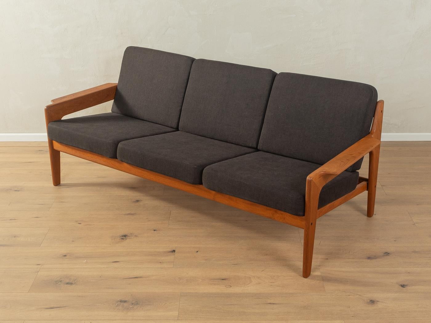 Classic 3-seater-sofa in teak from the 1960s by Arne Wahl Iversen for Komfort. The sofa has been reupholstered and covered with a high-quality fabric in black.

Quality Features:

    accomplished design: perfect proportions and visible attention to