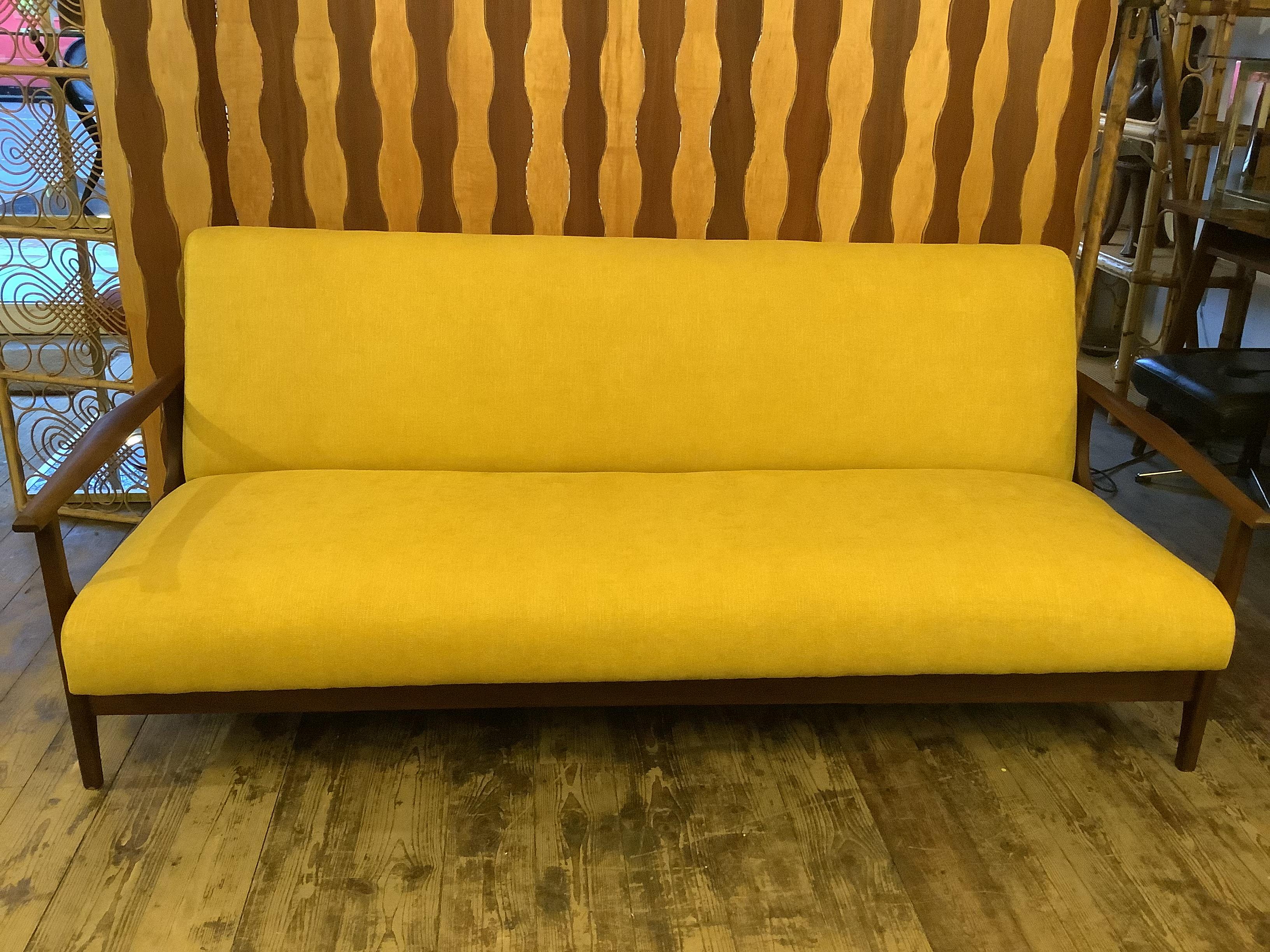 Reupholstered simple stylist functional sofa bed with solid teak frame and 

wonderfully reupholstered butter yellow  soft cotton fabric Cc 1960s