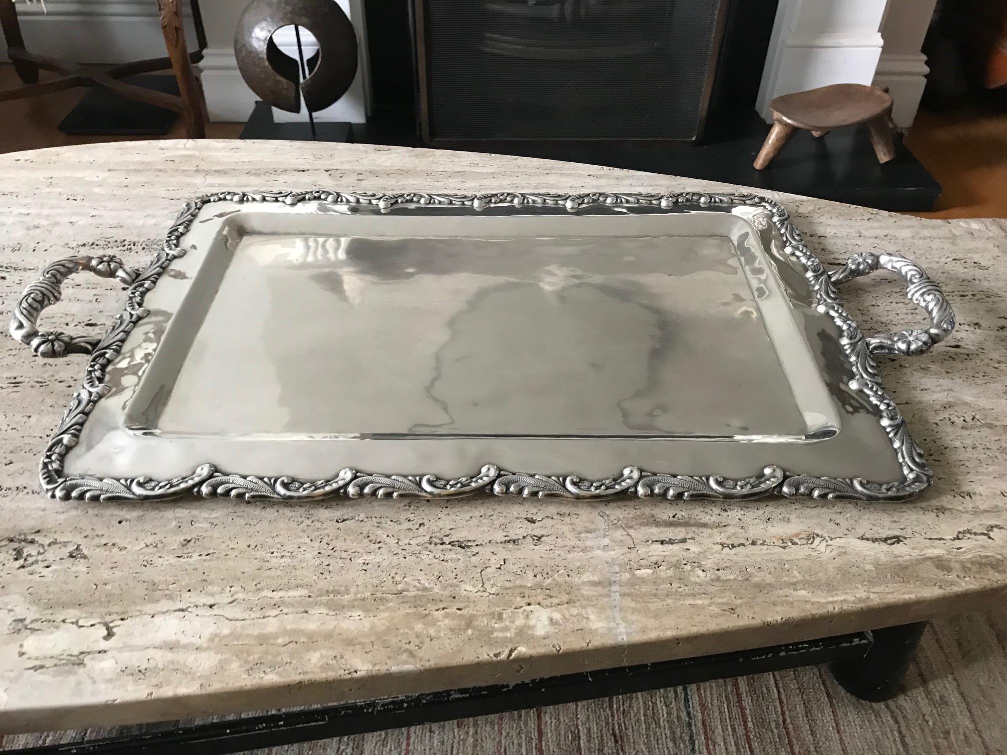 A stunning Peruvian solid silver tray in the Georgian style, circa 1960s.
  