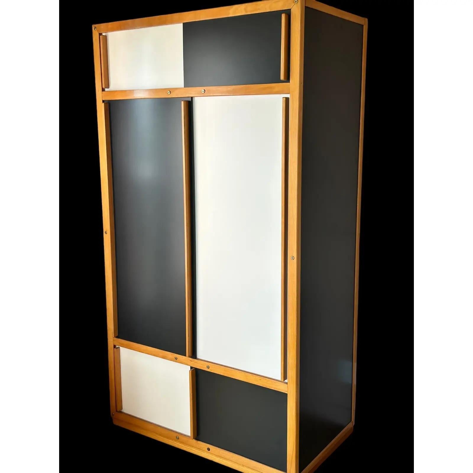 This midcentury cabinet, crafted by the renowned French designer André Sornay, is a true testament to his innovative design philosophy. The piece presents a masterful integration of materials, featuring a geometric composition that harmoniously