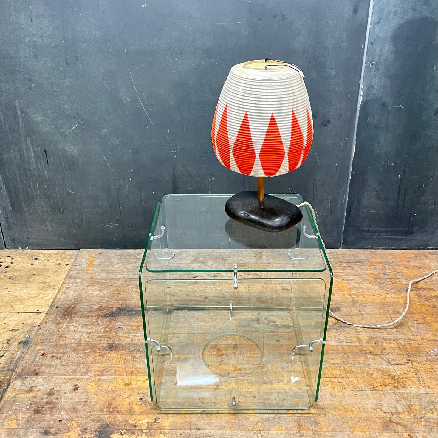 USA, circa 1963. A Steel and tempered glass cube table/pedestal by Gerald McCabe for Eon. The handling hole is 7 inches in diameter. This is the more uncommon slightly smaller version of this table.

There is a small scratch about 3 inches on one