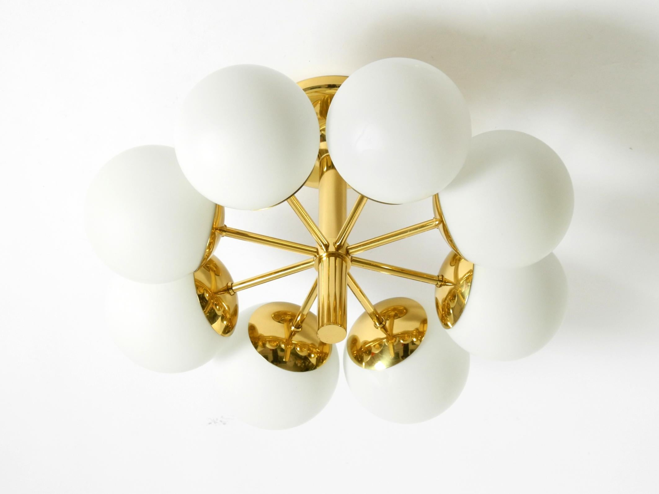 Tedesco 1960s Space Age brass ceiling lamp with 8 glass balls by Kaiser Leuchten in vendita