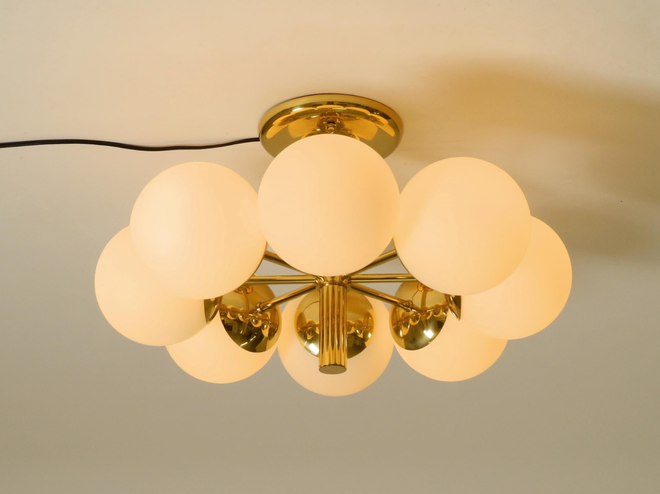 Metà XX secolo 1960s Space Age brass ceiling lamp with 8 glass balls by Kaiser Leuchten in vendita