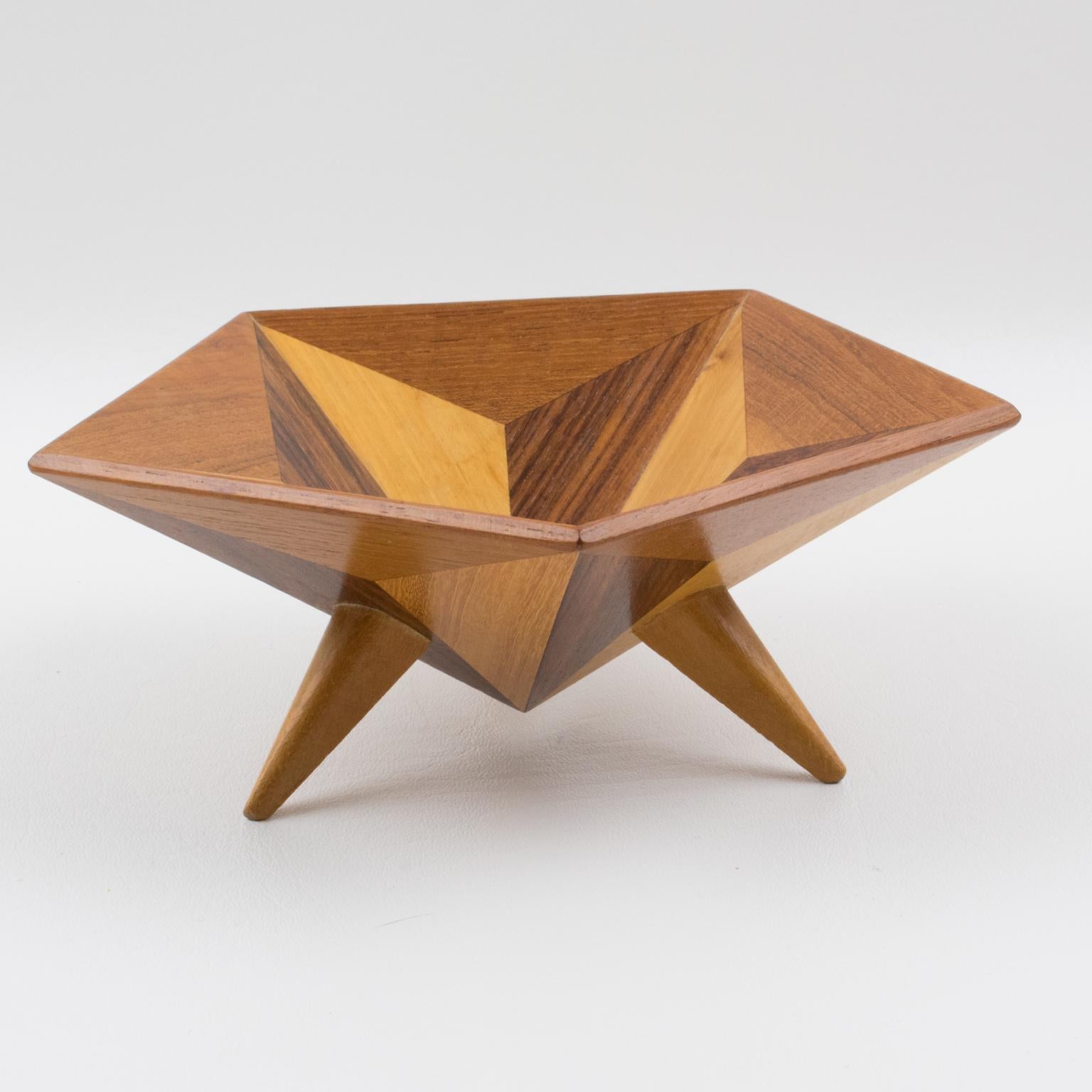 Exquisite modernist Space Age Danish carved bowl or centerpiece with wood marquetry. A geometric shape in typical spatial ship design with different woods in extremely fine grain, mixing mahogany, teak, rosewood, and limewood. No visible maker's