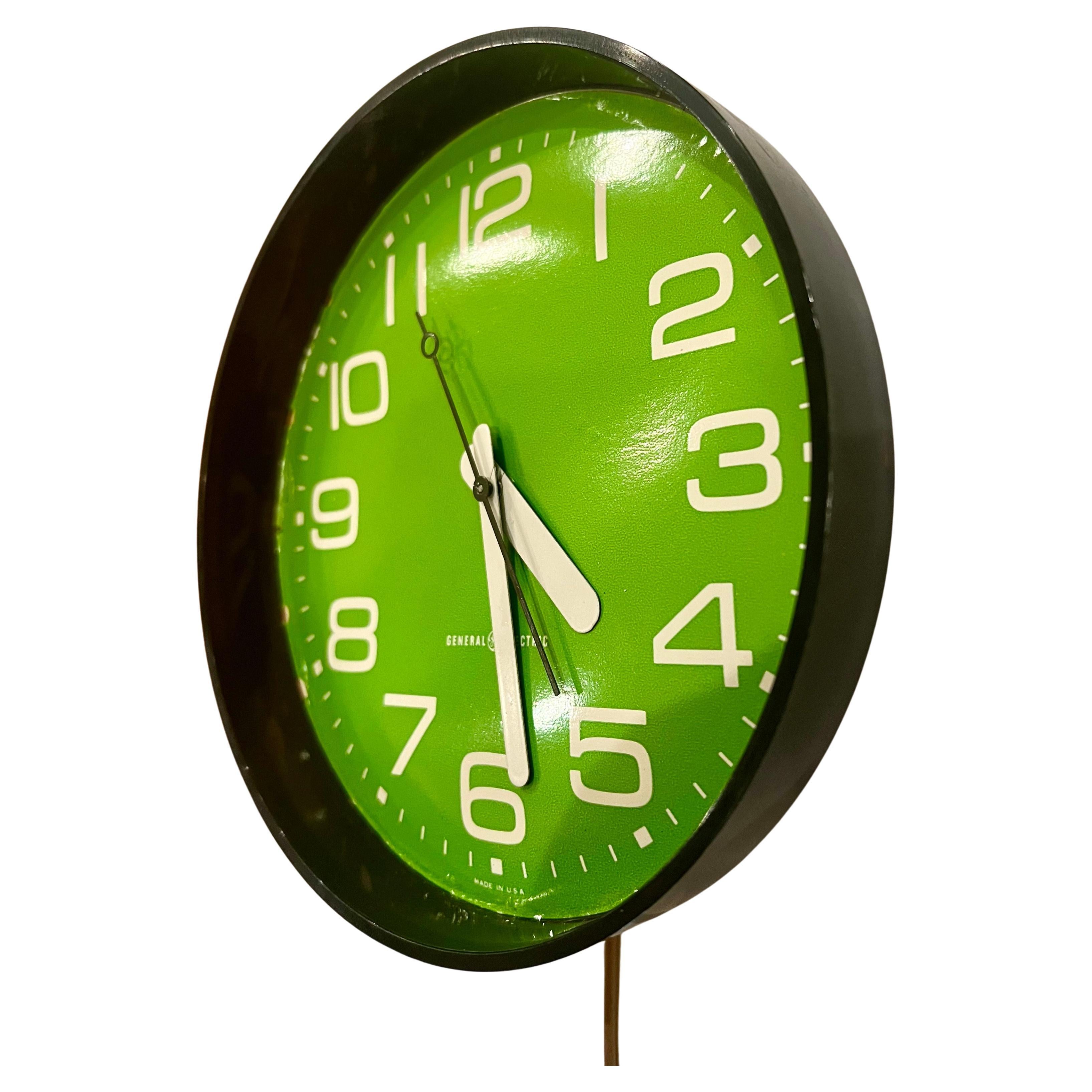 A very cool beautiful color Lime green plastic case with electric movement General Electric, wall clock in working condition original cord very nice simple design, and beautiful color. Great with mid-century Danish modern Postmodern home decor.