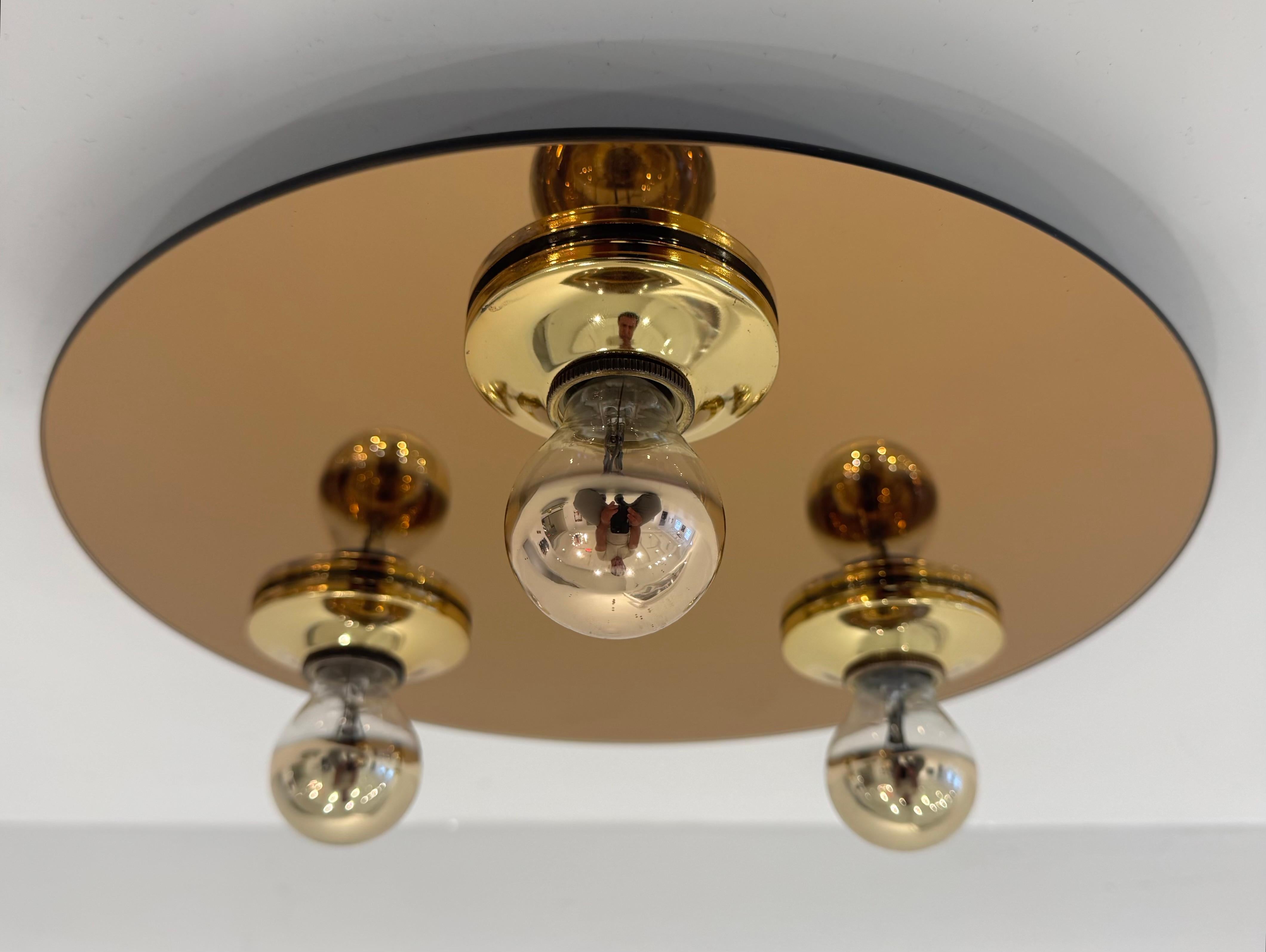 A great 1960s German copper mirrored glass and hold shade flush light. Rewired.