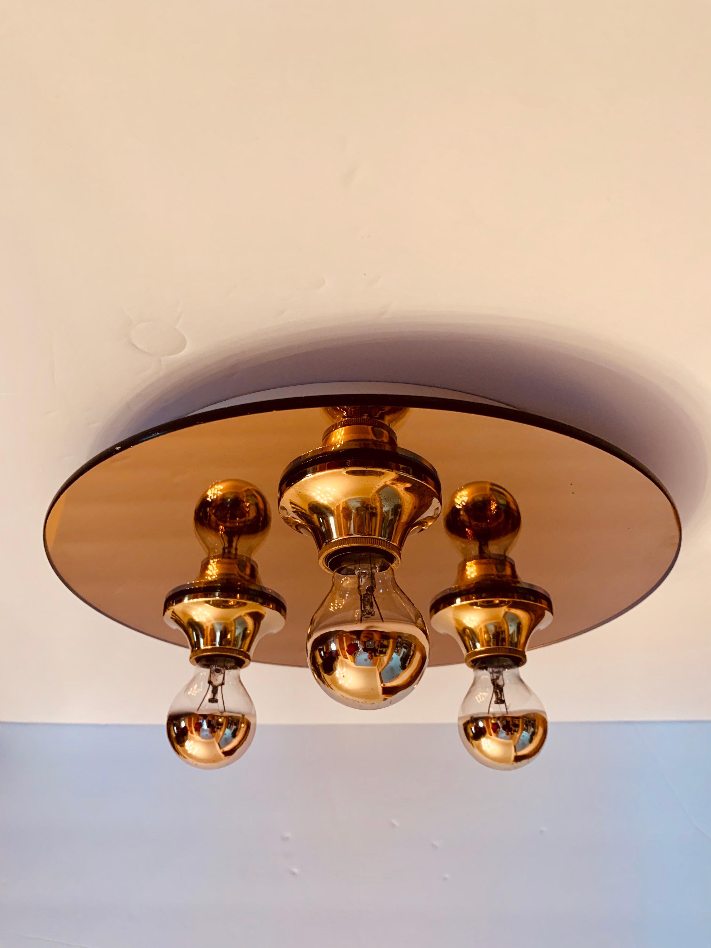 A great 1960s German copper mirrored glass and hold shade flush light. Rewired.