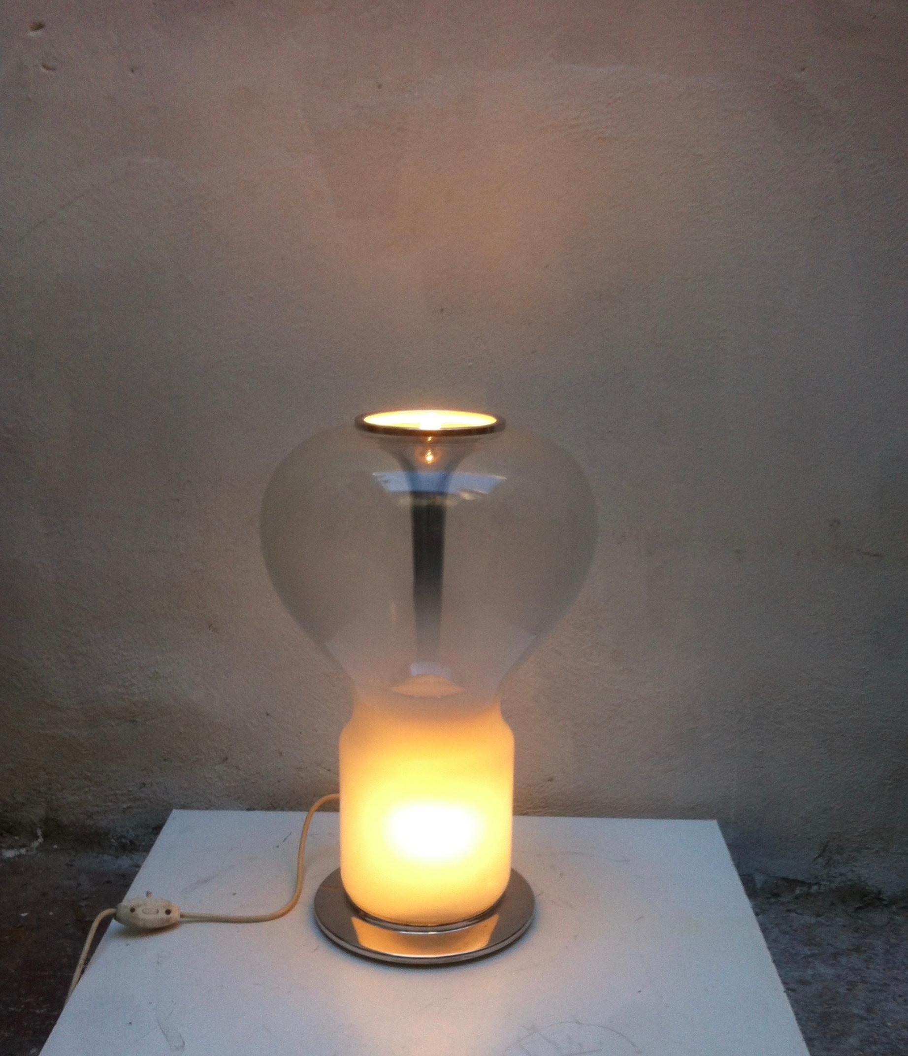 Midcentury Murano glass table lamp with 4 bulbs, 3 at the base and one on top. Can also be used as a floor lamp.
In the manner of Saffo table lamp designed by Angelo Mangiarotti for Artemide during the 1960s.
 