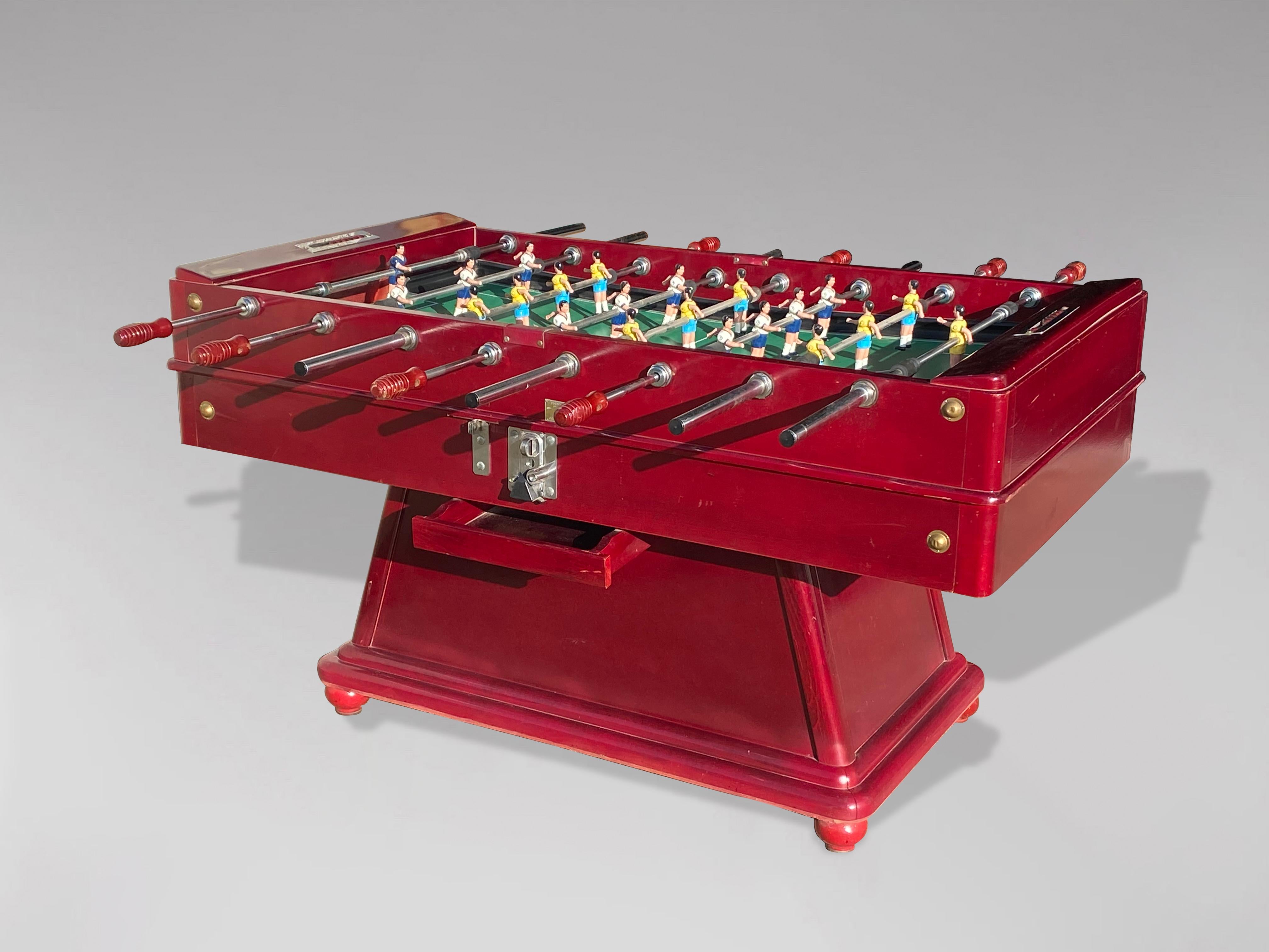 A fantastic original red cherry lacquer painted solid wood framed Spanish football table from a bar or café. Comes complete with painted metal players, an abacus-type scoring system and a set of footballs. Two of the best features of this