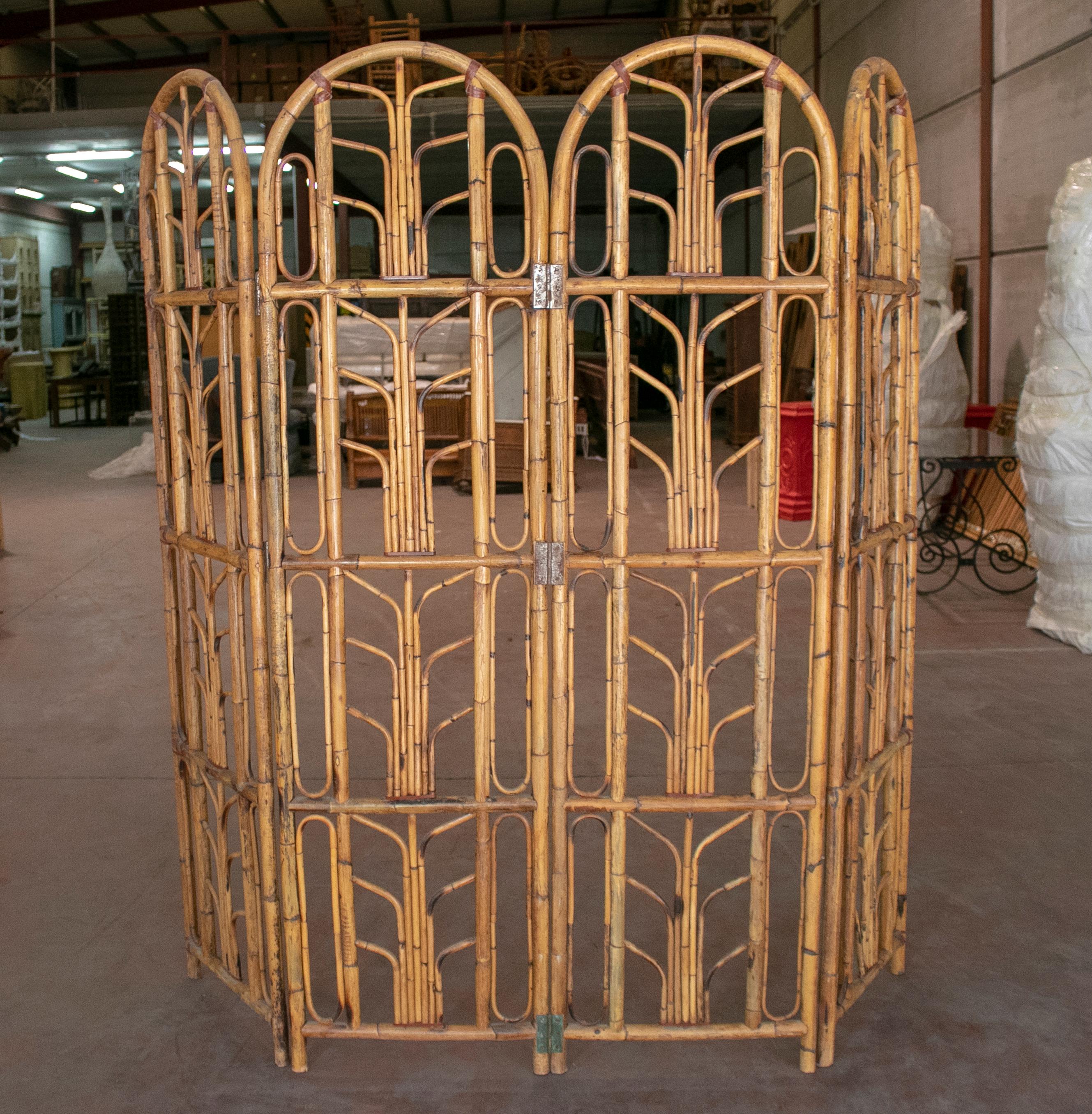 Vintage 1960s Spanish four-panel bamboo folding screen.