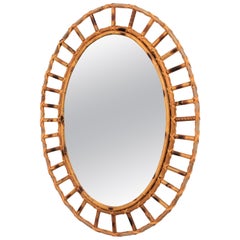 1960s Spanish Mediterranean Style Rattan and Bamboo Oval Sunburst Mirror