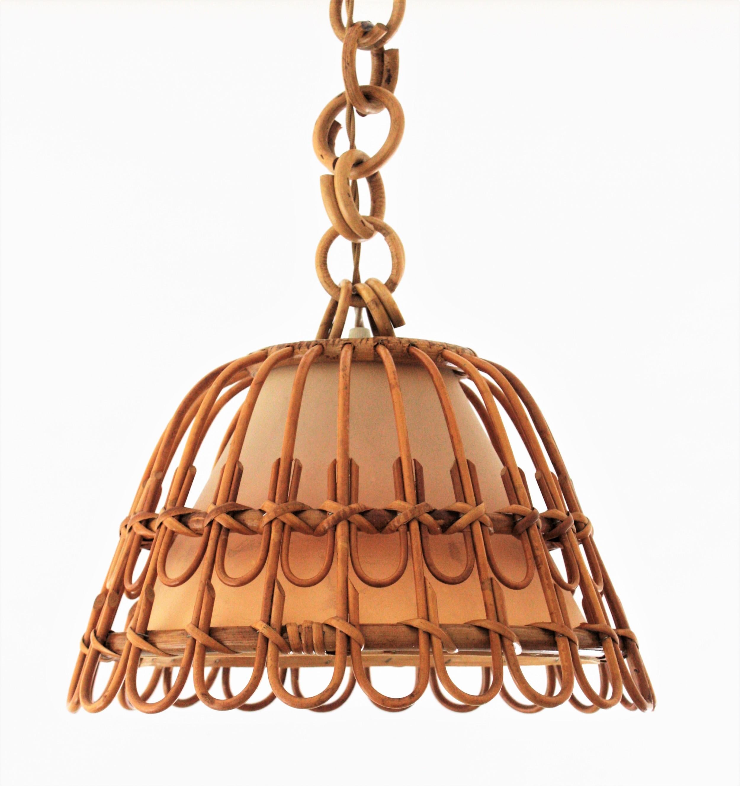 A beautiful handcrafted rattan /wicker pendant light with geometric petal design, Spain, 1960s.
It hangs from a rattan / bamboo chain that can be modified to make it shorter and it has a shade light difusser to filter the light. This lamp could add
