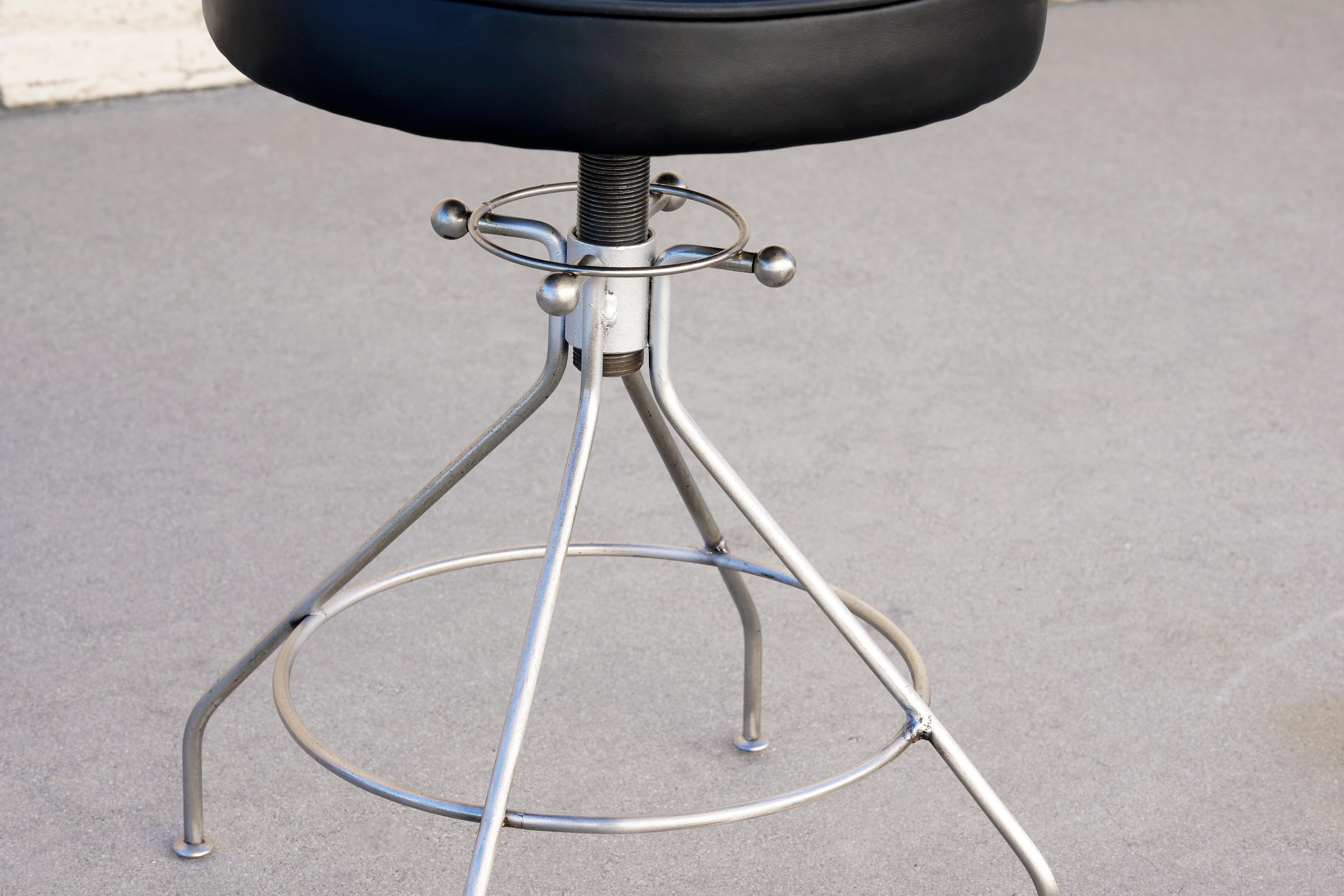 Very cool Sputnik/ atomic style stool, circa 1960s. Features a sculptures steel base and seat newly reupholstered in black leather. Seat is adjustable.

Dimensions: 14
