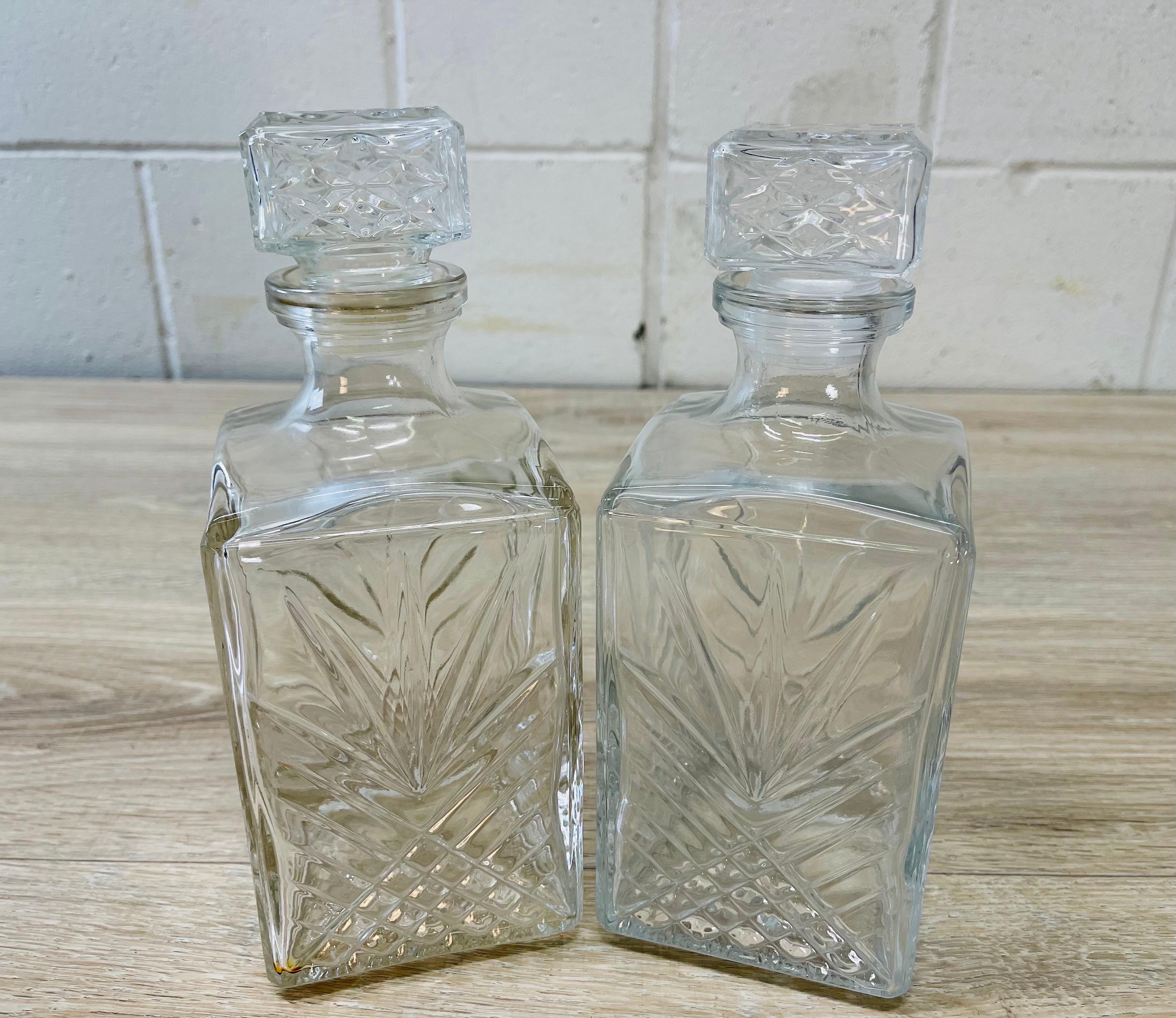 Vintage 1960s pair of square glass decanters with a fan design. Decanters are marked Italy.