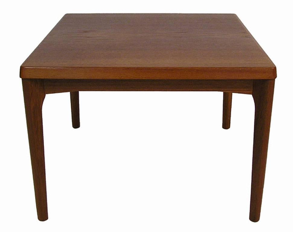 A gorgeous square teak side table from the 1960s designed by Henning Kjaernulf for Vejle Stole Mobelfabrik of Denmark. Alternately would work well for use as a smaller scale coffee table. Quality craftsmanship throughout featuring clean Danish