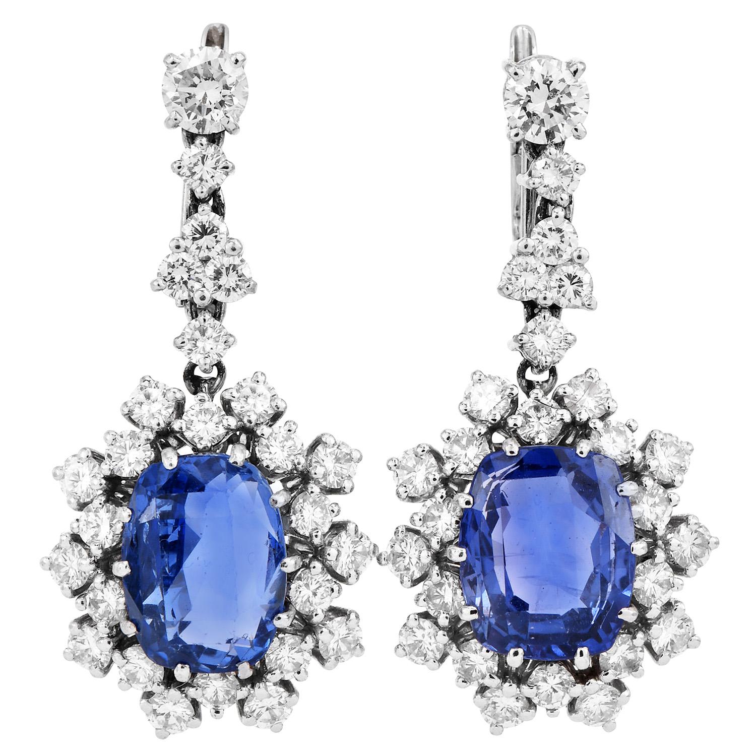 Presenting a beautiful vintage timeless Dimond Halo Princess Dangle Drop Earrings forged in Platinum.

GIA Certified Blue Modified Brilliant step Cushion Cut Extra Clean Sri Lankan Corn Flower Natural Sapphire 

Secured with Latch Back