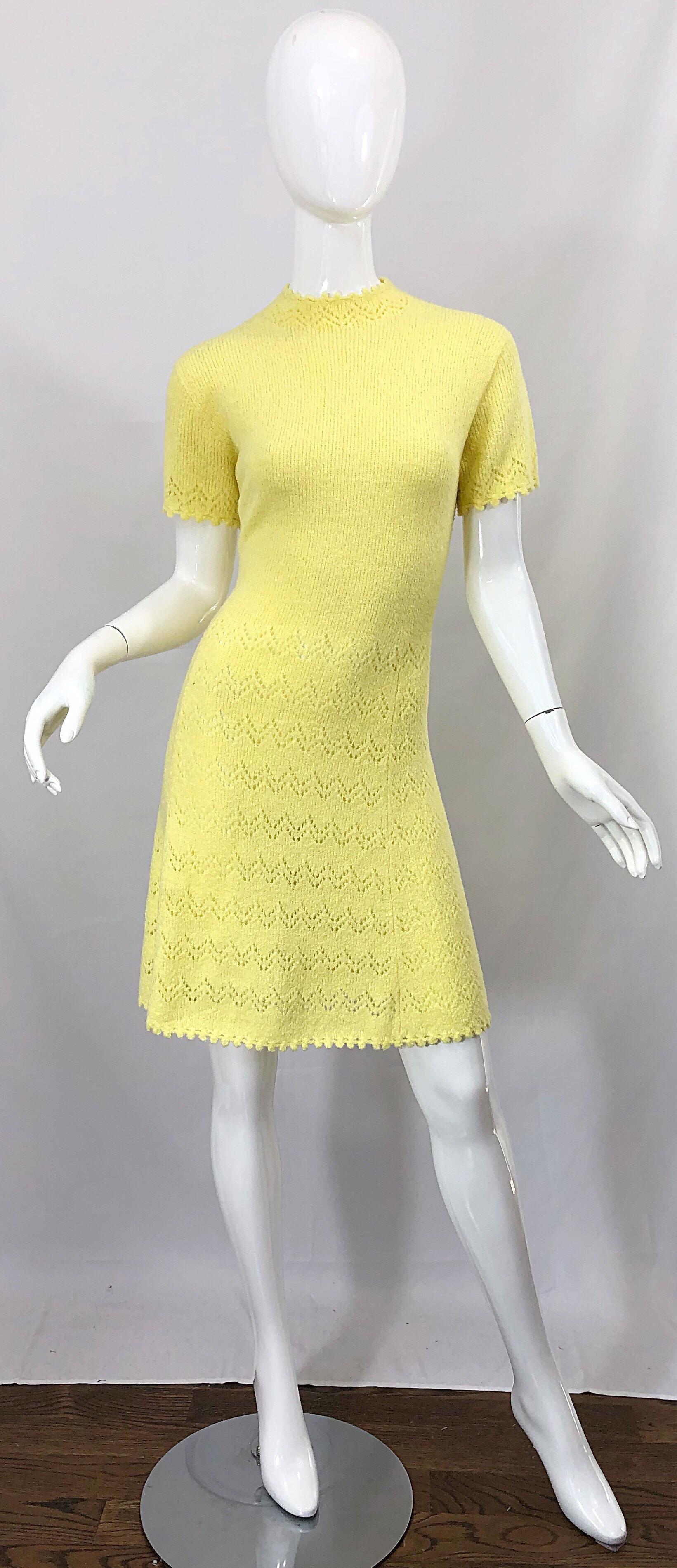 Tres chic ST. JOHN signature santana knit canary yellow short sleeve A-Line dress! Features the softest knit that stretches to fit. Hand crochet detail at the neck, sleeves and below the waist. Full metal zipper up the back with hook-and-eye