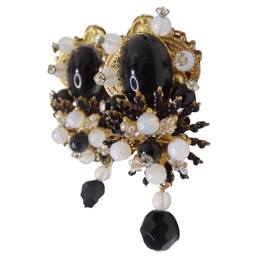 Gorgeous vintage Stanley Hagler NYC drop earrings circa 1960s! A cluster of black, white and silver beads surround a black moonstone in the center with solid gold accents as the finishing touch. The glamorous yet classic look of these earrings will