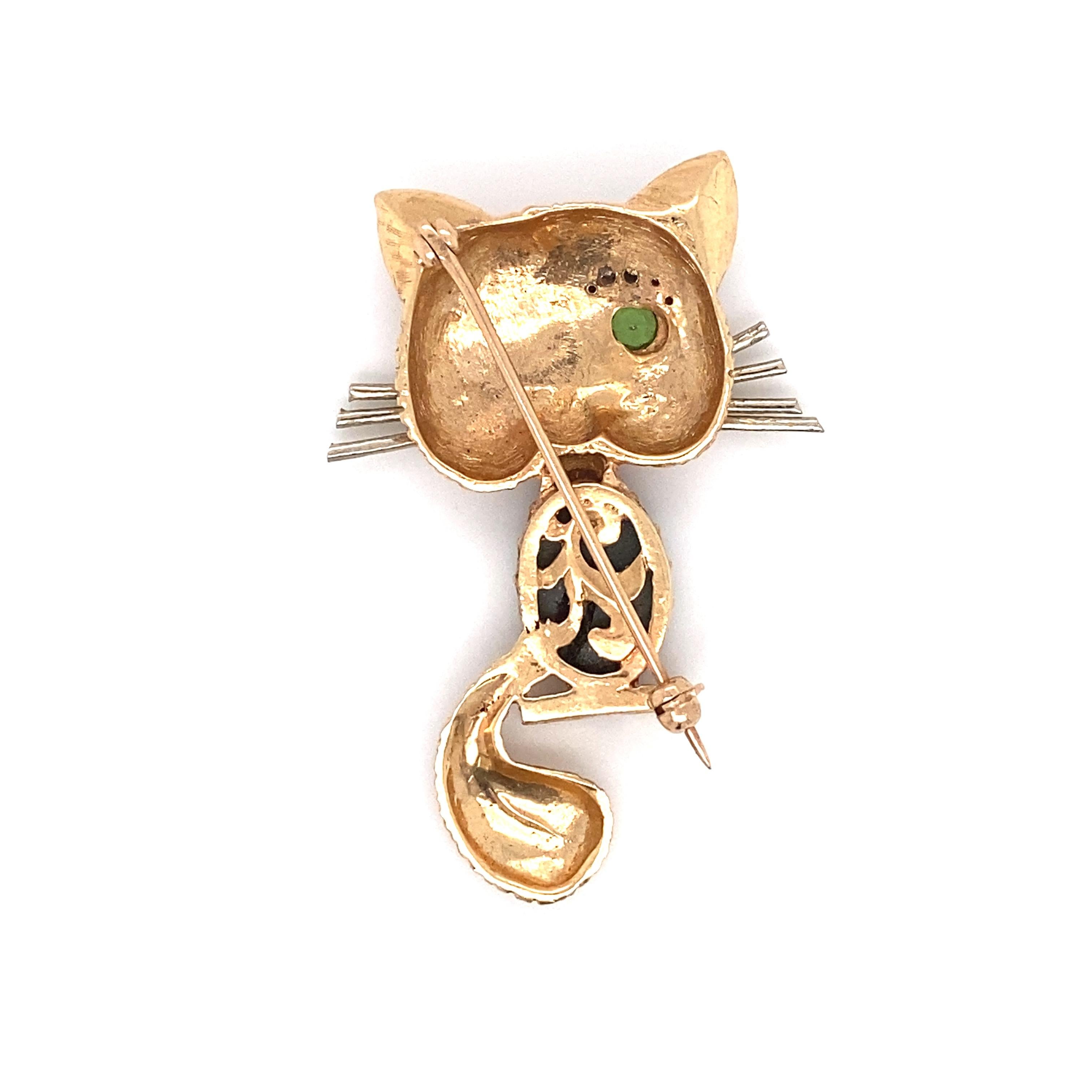 Circa: 1960s
Metal Type: 14 Karat Gold
Weight: 10.8 grams
Dimensions: 1.75 inch Height x 1 inch Width 

Whimsical Cat Brooch featuring a combination of sapphire, peridot and diamonds. Crafted in 14 Karat Gold, it is a stunning jewel from the 1960s! 
