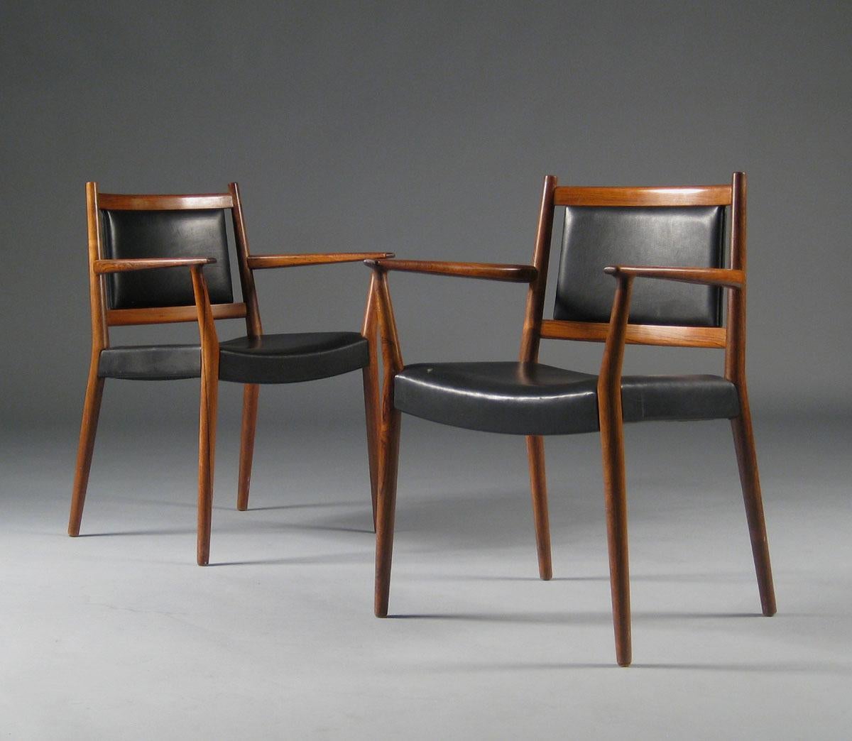 1960s Steffen Syrach-Larsen, four solid wood armchairs available separately. Seat and back upholstered with lightly patinated black natural leather. Made by cabinetmaker Gustav Bertelsen. H:77 W:59 D: 47 Seat Height: 44 cm. Model presented at The
