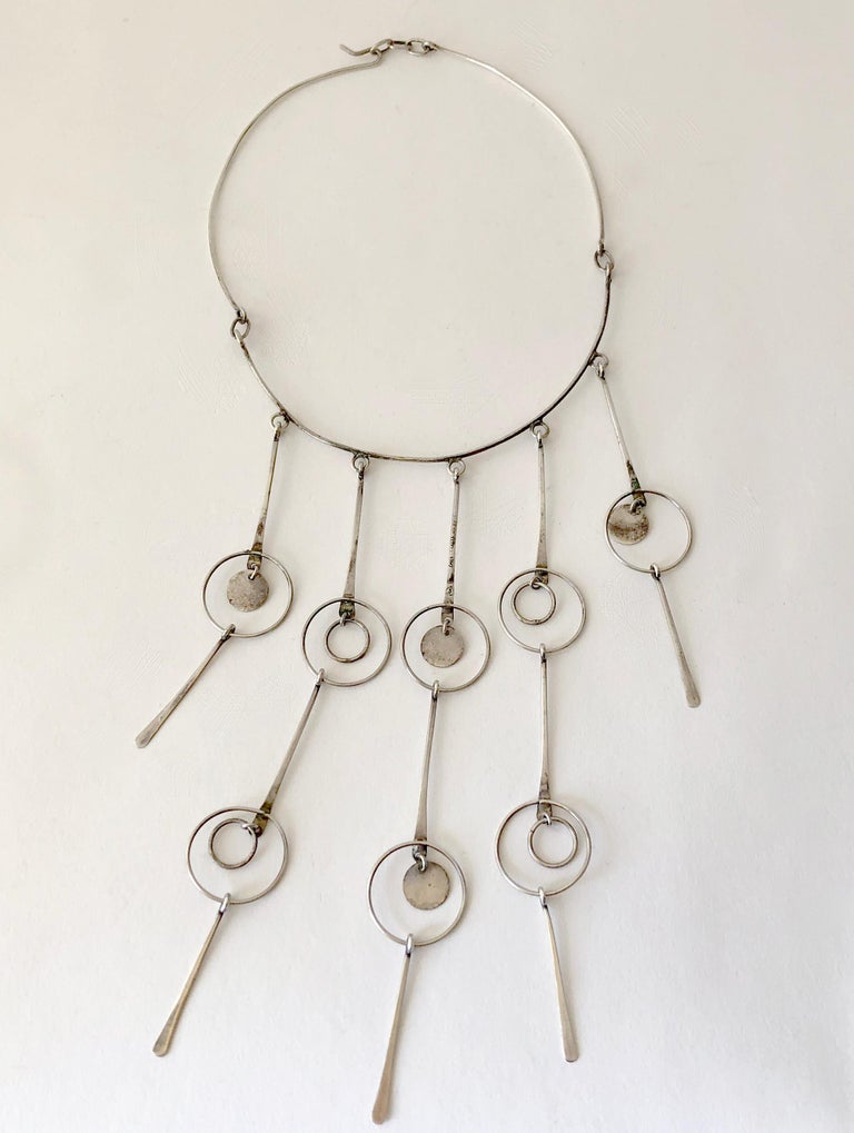 Sterling silver Mexican modernist fringe kinetic necklace circa 1960's or 1970's, maker unknown. Necklace is as light as a feather and has a glistening effect with all of its movable parts.  Piece has a wearable neck length of 16.75