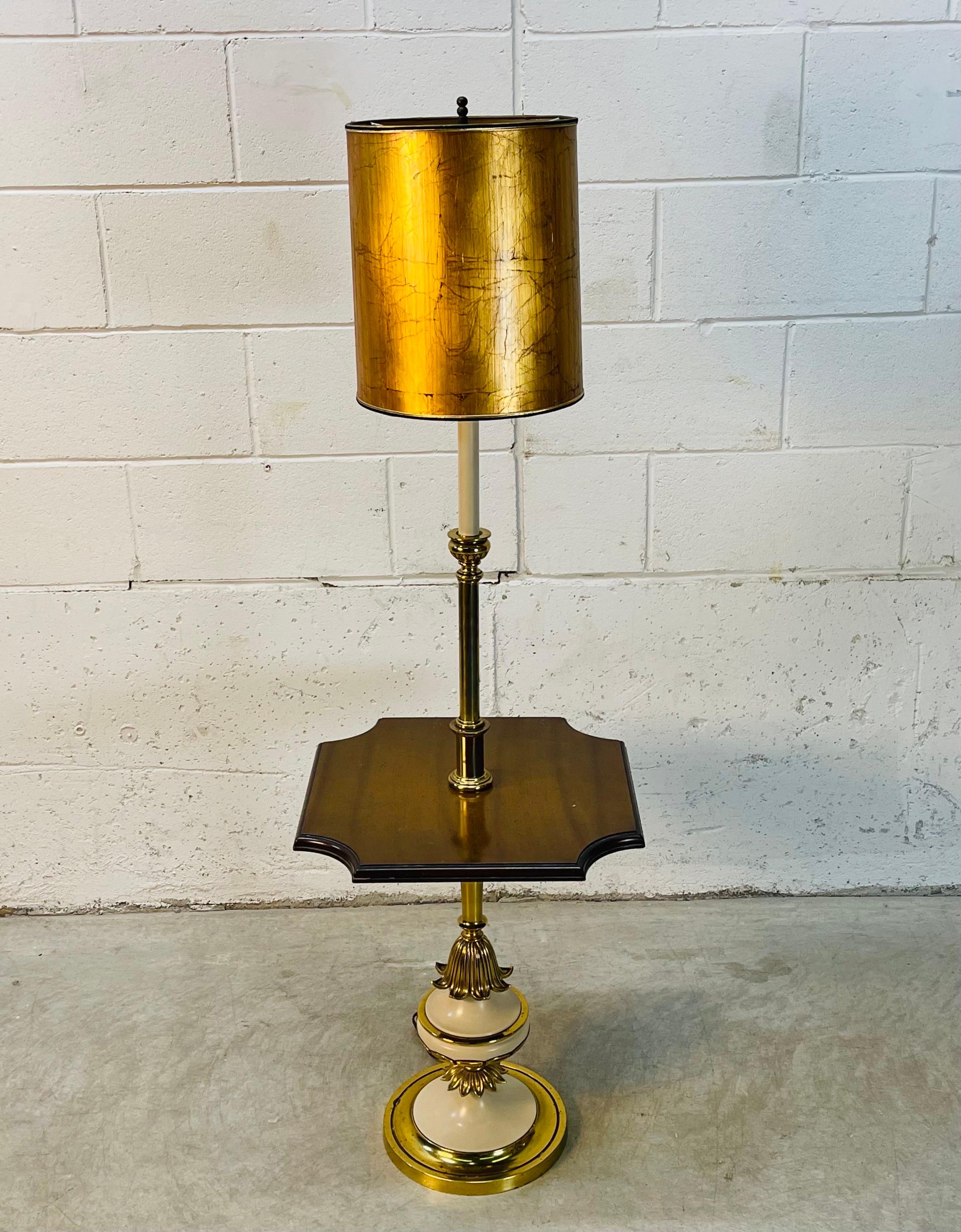 Vintage 1960s Stiffel floor lamp with gold matching shade. The lamp is made of painted metal and the table is a solid wood. The socket is 45” H. The harp is 4.5” Diameter x 8” Height. The shade is 10” Diameter x 12” Height. Wired for the US and in