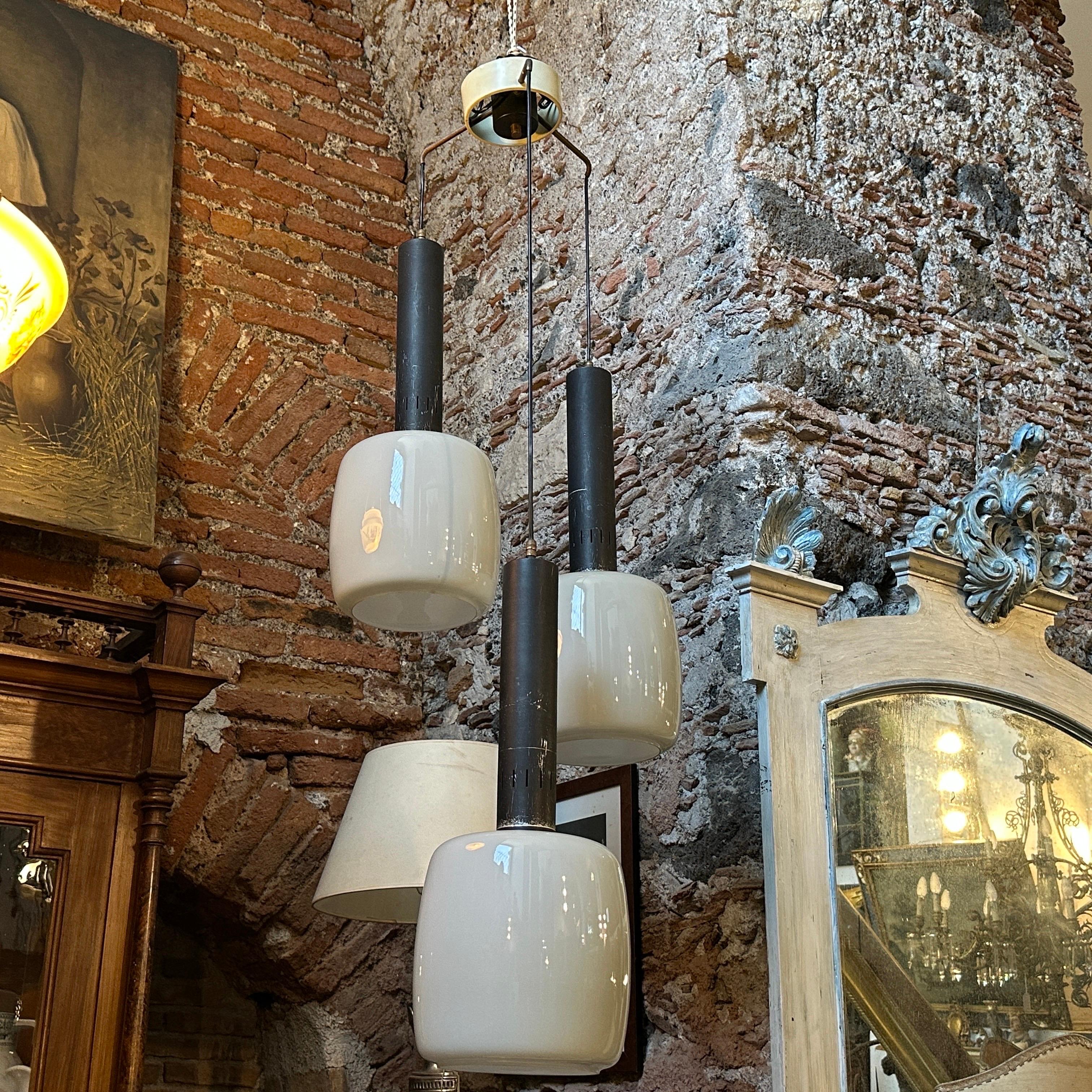 1960s Stilnovo Attributed Mid-Century Modern Gray Opaline Italian Chandelier
Elevate your space with this stunning 1960s Italian chandelier attributed to Stilnovo, a renowned name in Mid-Century Modern design. Featuring three elegant gray opaline