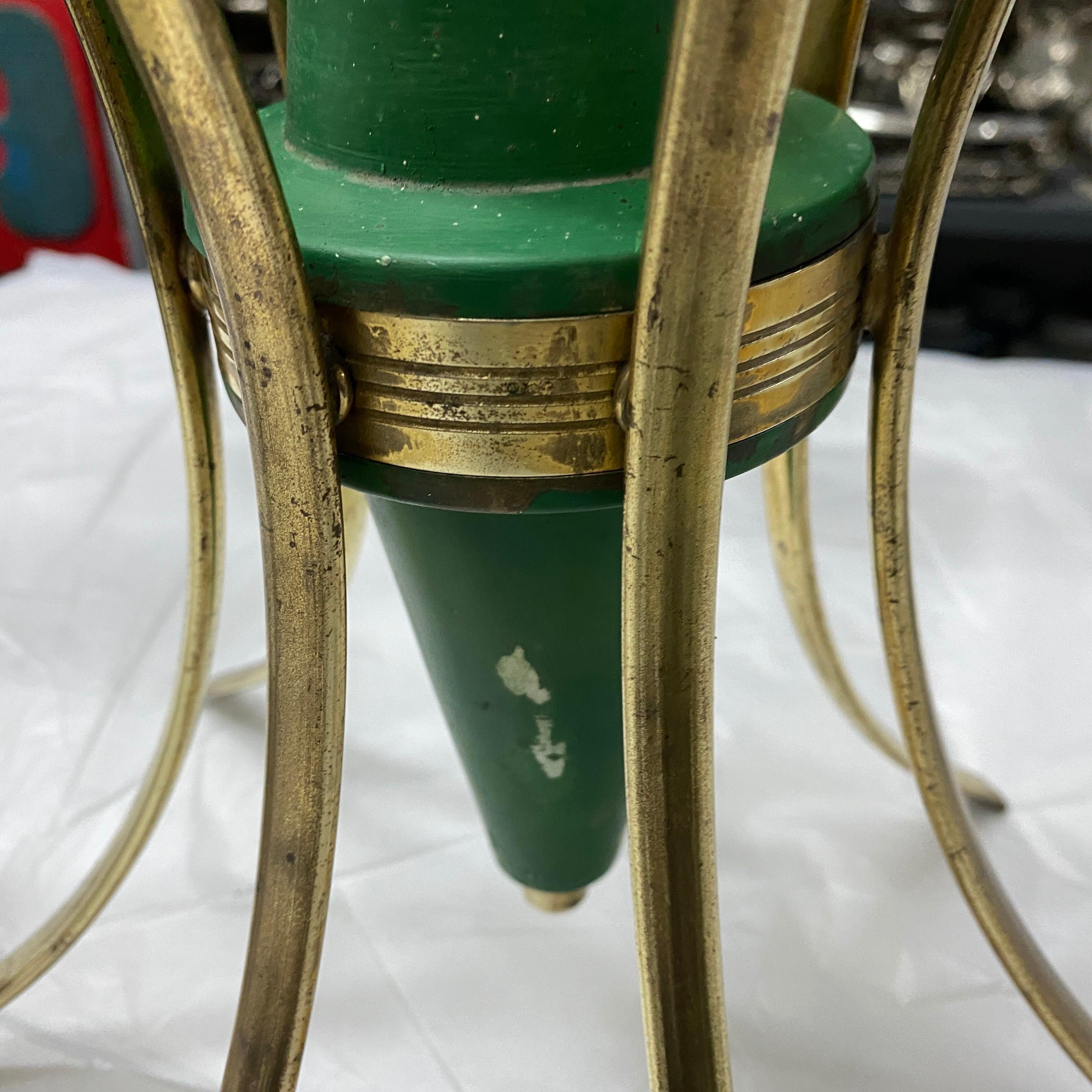 A six lights chandelier manufactured in the style of Stilnovo in the Sixties, brass it's in original patina, green painted metal is in good conditions, the white opaline diffusors are in perfect conditions, it works 110-240 volts and needs six