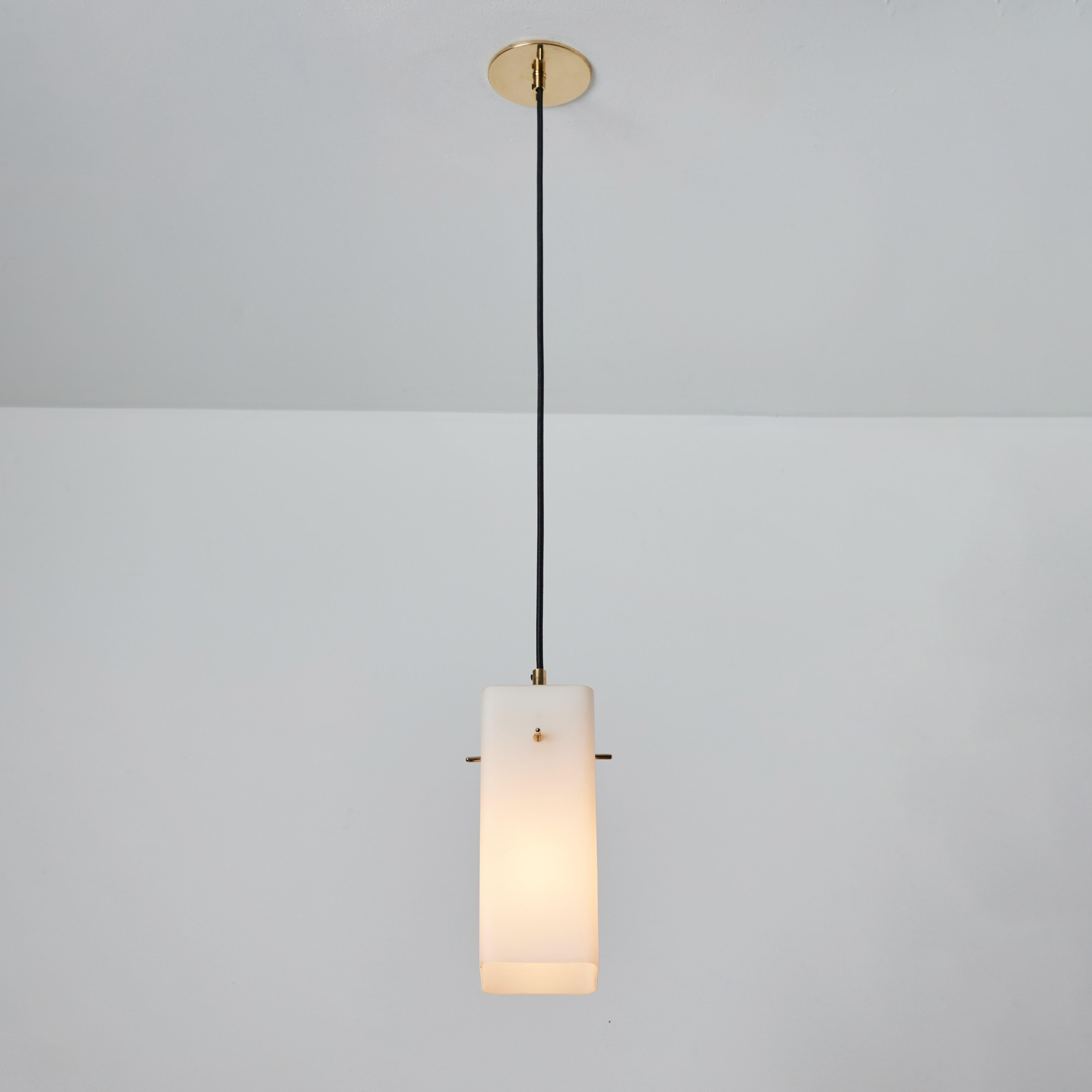 1960s Stilnovo Opaline Glass & Brass Pendant. Executed in sculptural geometric opaline glass with brass hardware. A highly refined ceiling lamp light of attractive scale and incomparable refinement. Unmarked.

Stilnovo was one of the most innovative