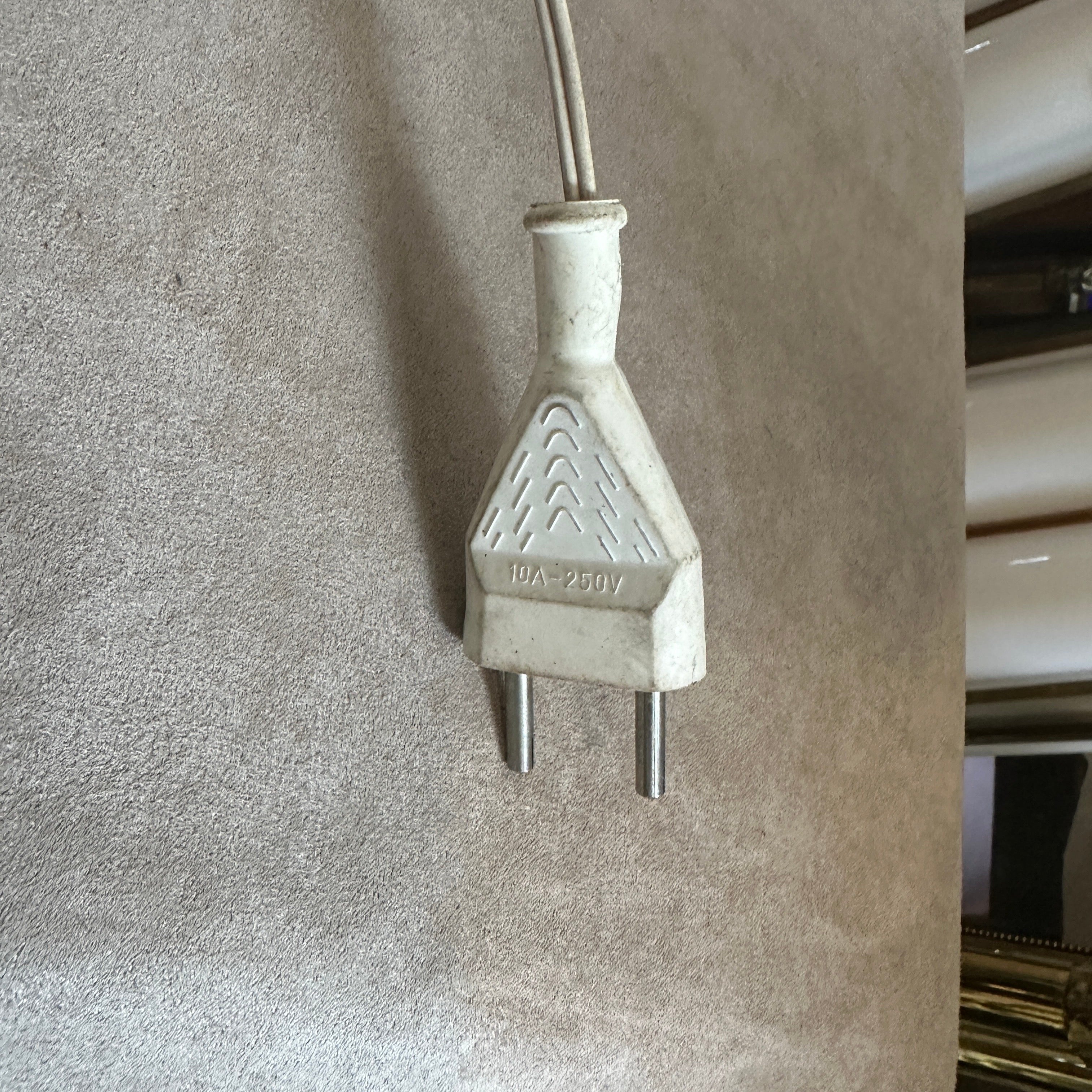 A sputnik table lamp designed and manufactured in Italy in the Fifties. The lamp it's in working order, brass it's in original patina, the light green aluminum cone has signs of use and age all visible on the photos.  This lamp represents an iconic