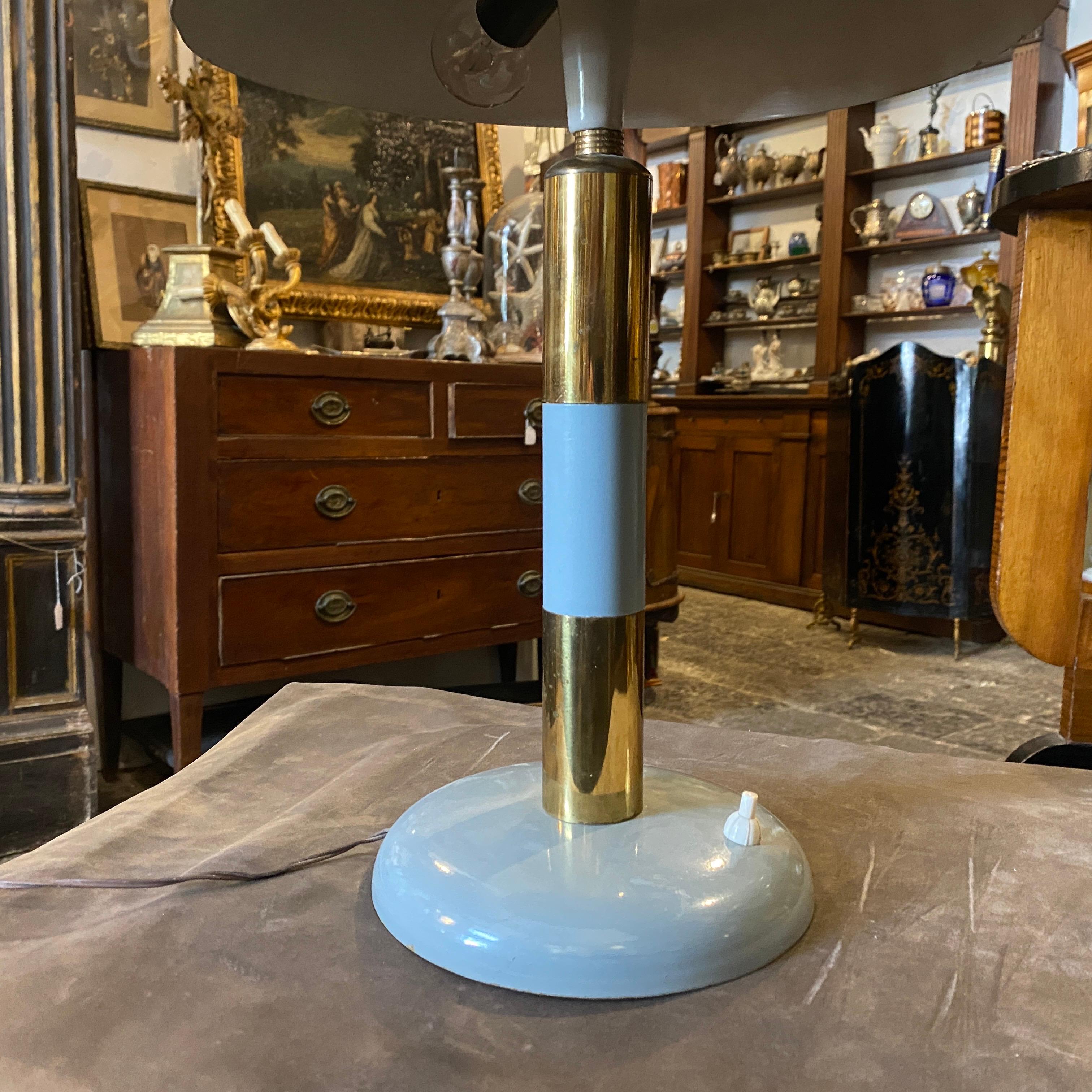 A Mid-Century Modern blue-gray metal and brass table lamp in good conditions, it works 110-240 volts and needs two regular e14 bulbs.