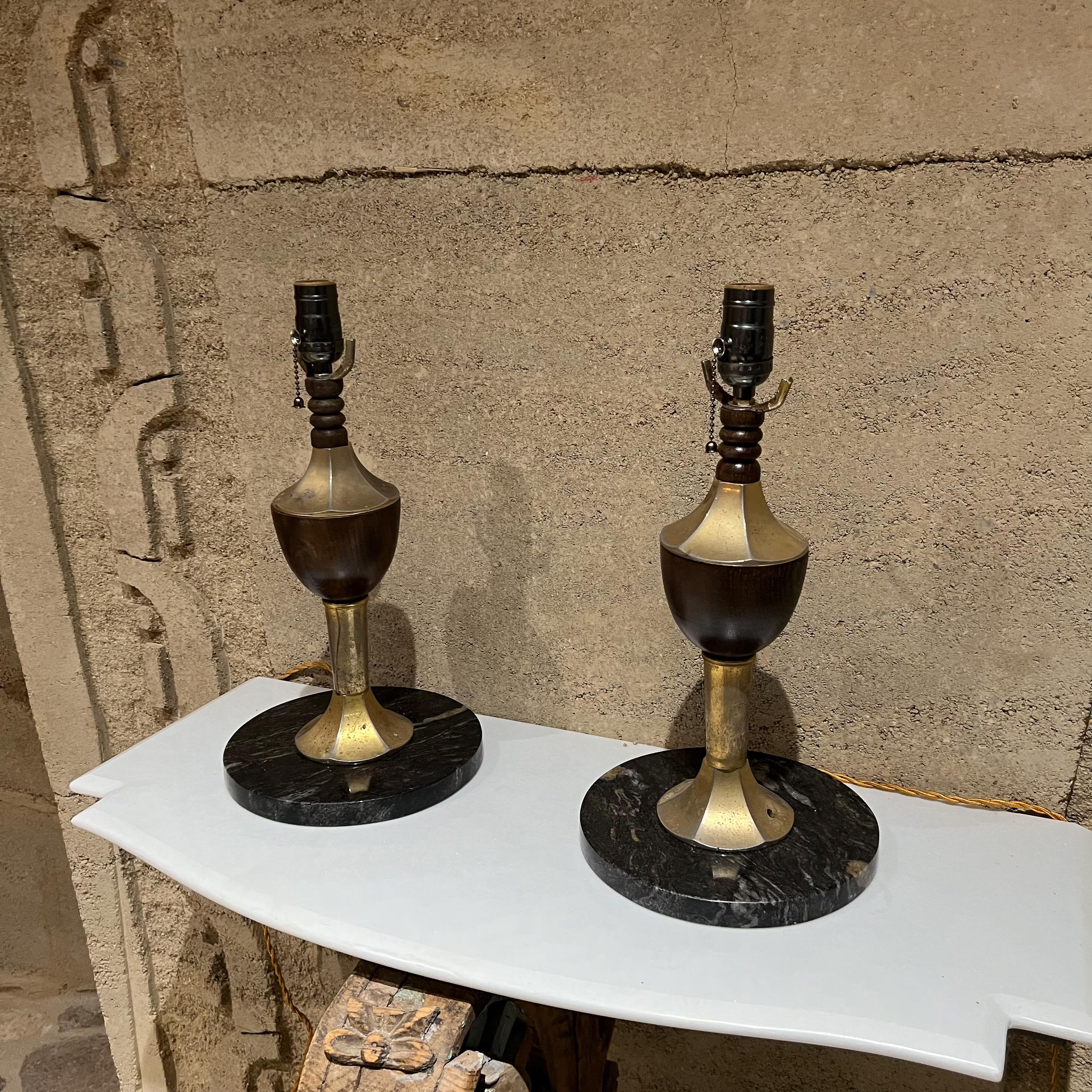 Table lamps Mexican Modernism
1960s Striking table lamp pair Modern black and gold goblet on round marble base
Unmarked
Style of Roberto and Mito Block
Measures: 16 tall to socket x 8.5 in diameter
Original preowned unrestored vintage