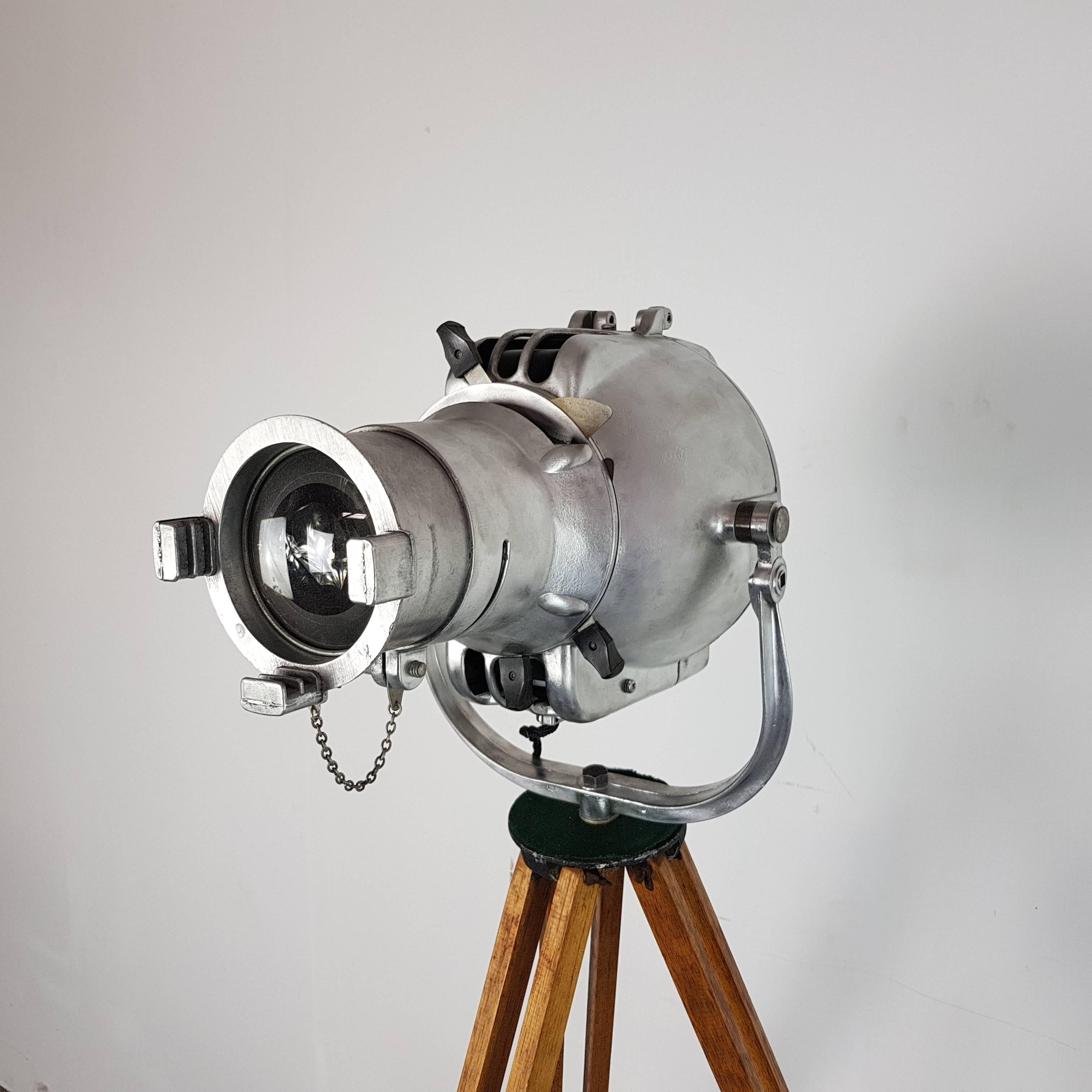 English 1960s Stripped and Polished Strand 23 Theatre Light on Vintage Wooden Tripod For Sale