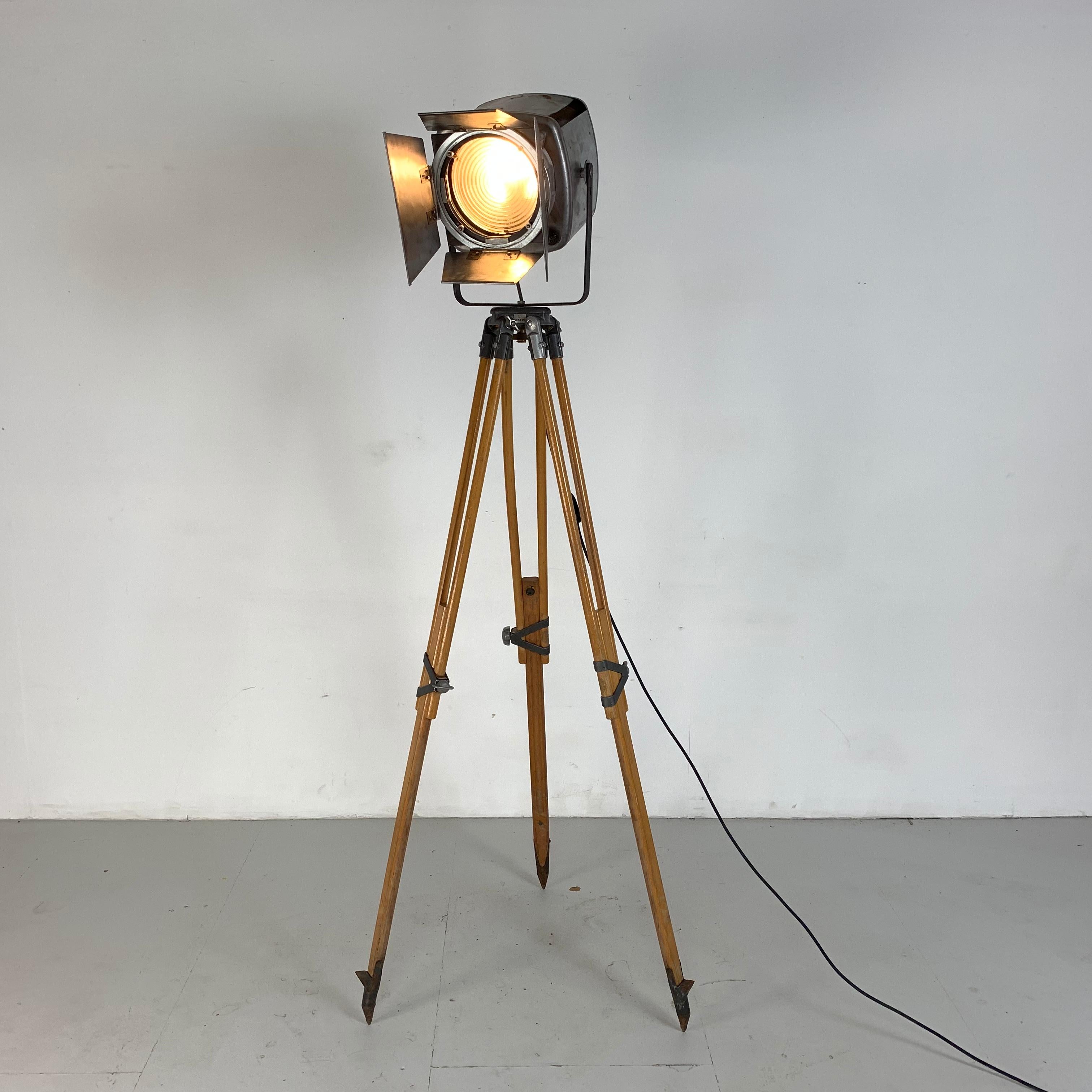 English 1960s Stripped and Polished Strand 743 Theatre Light on Vintage Wooden Tripod For Sale