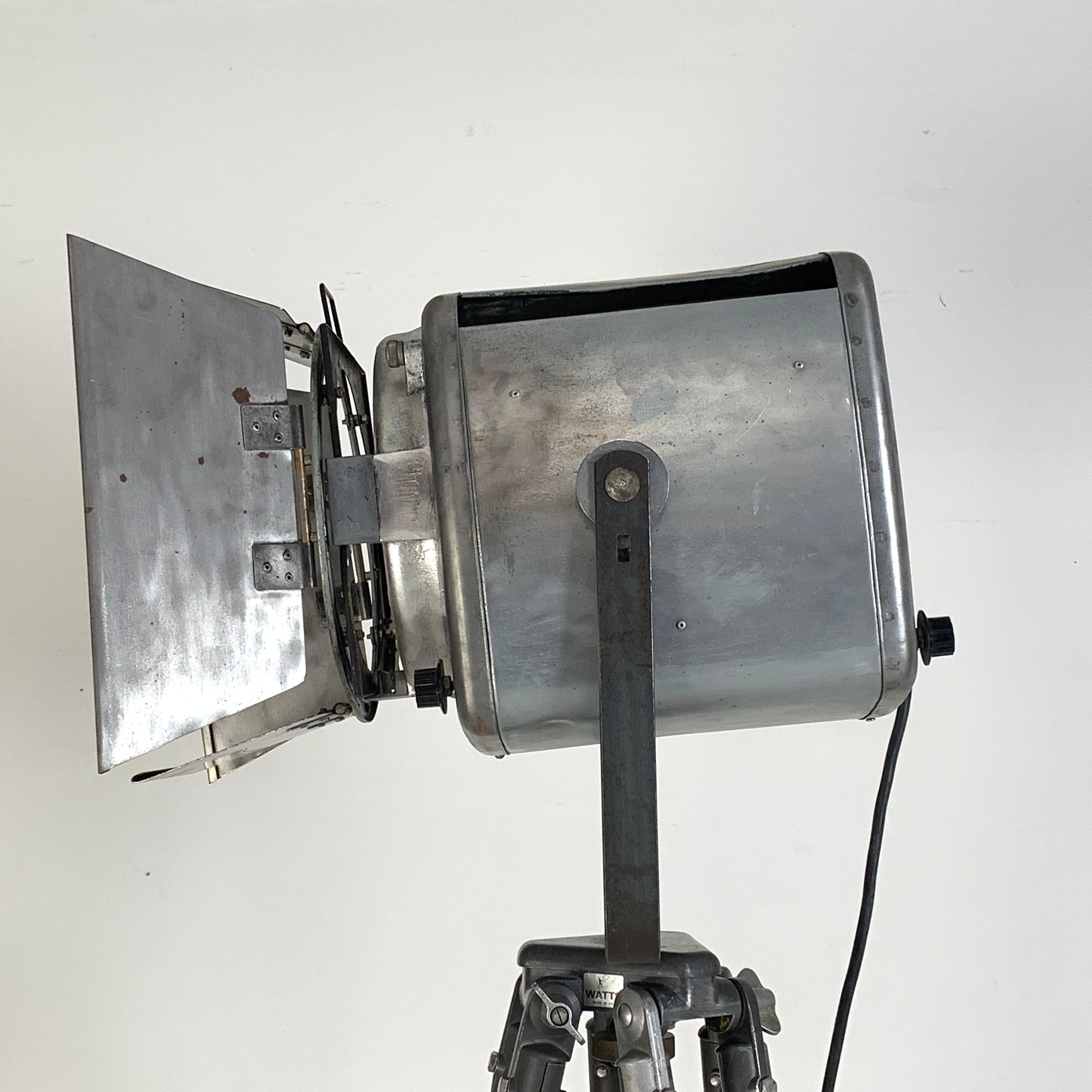 Metal 1960s Stripped and Polished Strand 743 Theatre Light on Vintage Wooden Tripod For Sale