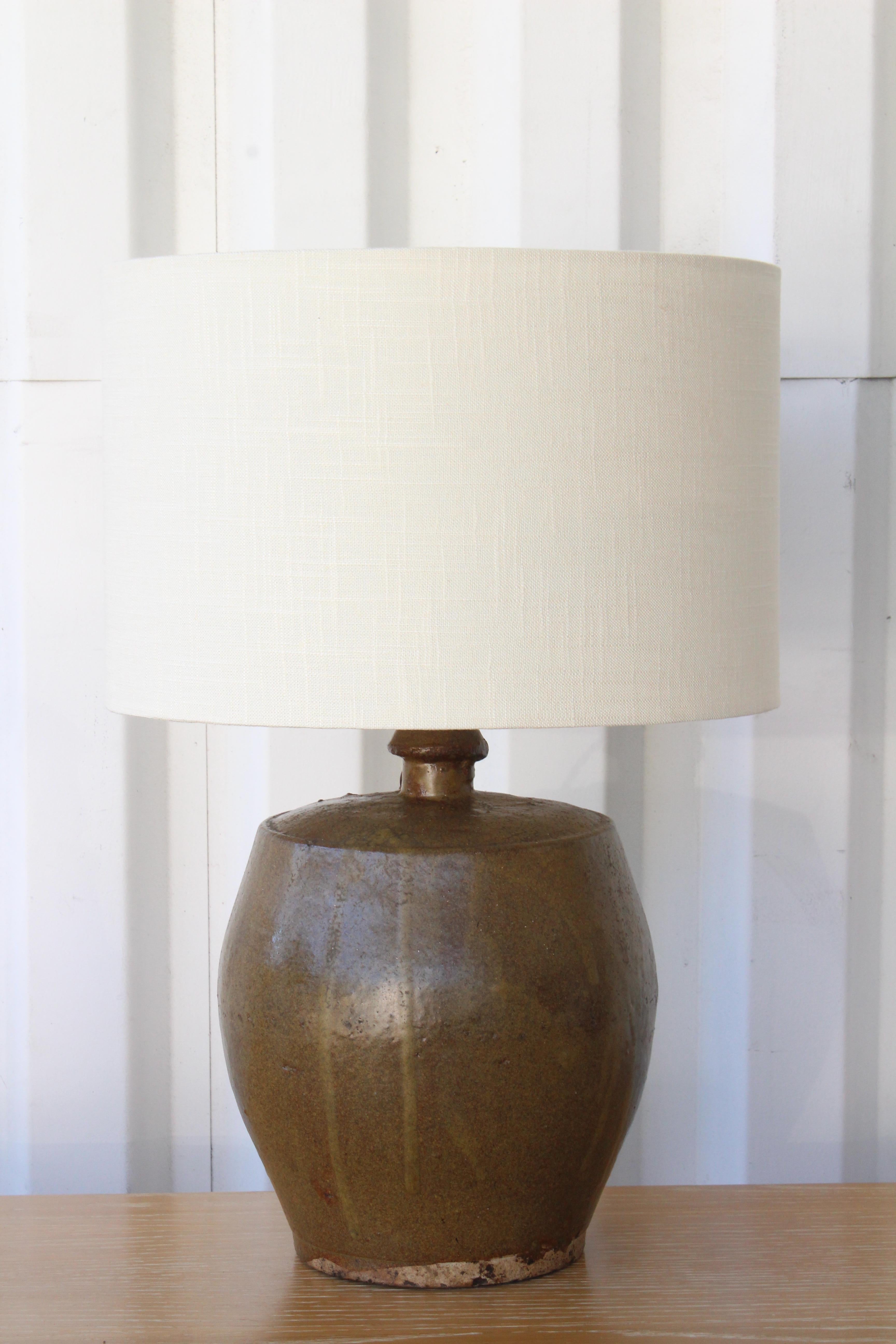 Vintage studio ceramic table lamp. New french wiring in a twisted silk cord. New custom made shade in linen. 21