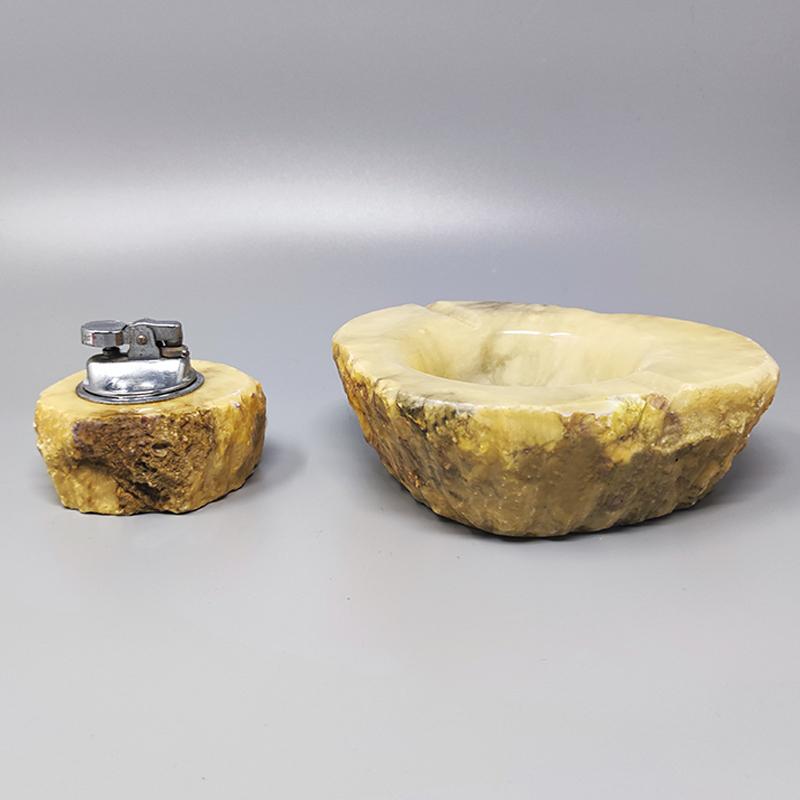 1960s Stunning alabaster smoking set by Romano Bianchi with ashtray and table lighter, everything is handmade carved. The table lighter works perfeclty. Made in Italy. This smoking set is in excellent condition.
Dimension :
Ashtray 5,90 cm x 6,69
