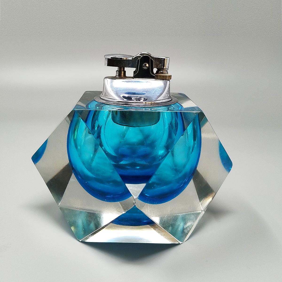 1960 Stunning blue table lighter in Murano sommerso glass by Flavio Poli for Seguso. Made in italy. The item is in excellent condition and it works perfectly
Dimension:
diam 4,72 x  3,93 H inches
diam cm 12 x cm 10 H
