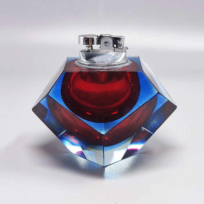 1960 Stunning  table lighter in Murano sommerso glass by Flavio Poli for Seguso. Made in italy. The item is in excellent condition and it works perfectly
Dimension:
diam 5,11