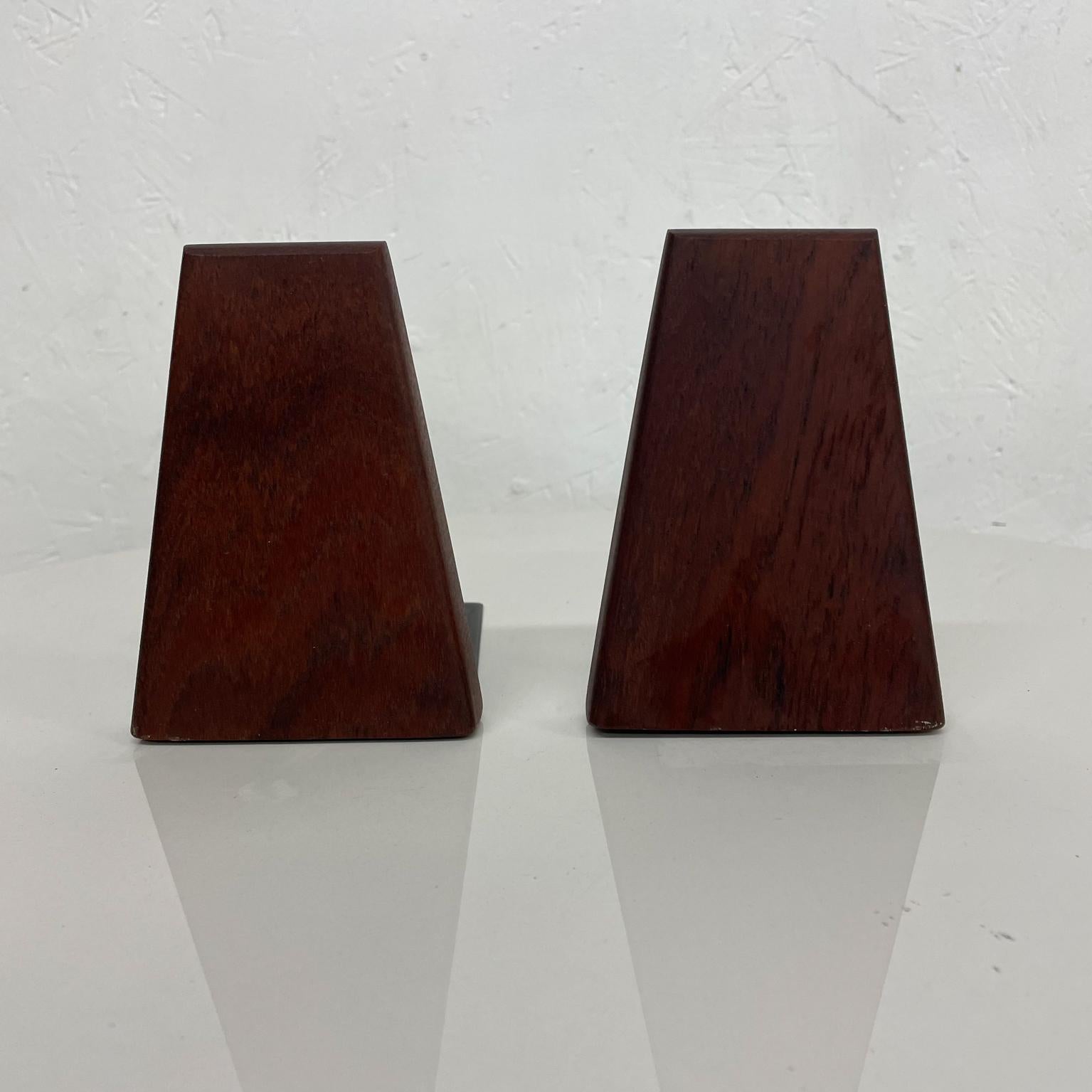 Teak Bookends
1960s Style of Kai Kristiansen Modern Bookends in Teak Wood and Metal made Denmark
Maker stamp present Denmark ESA
3.75 w x 5.13 x 5.5 d
Preowned original vintage condition.
See images provided.
 