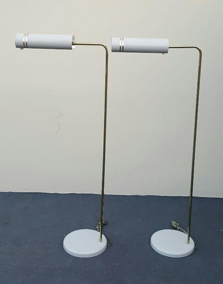 1960s Gerald Thurston stylized matching space age reading floor lamps.
These rare Gerald Thurston Space age lamps (2) are in excellent vintage condition.
Gorgeous shades that hover like a space ship.
Great lighting ability for reading. Perfect
