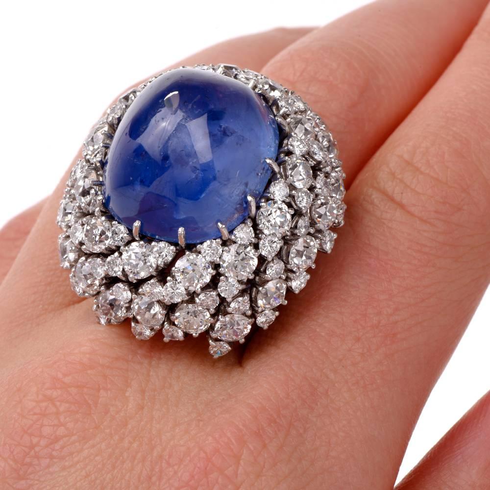 This captivating cocktail ring of prominent pyramidal design is centered with a GIA certified natural cushion sugarloaf cabochon star sapphire approx. 48.70 carats with visible display of asterism and no treatment. The fascinating gemstone measures