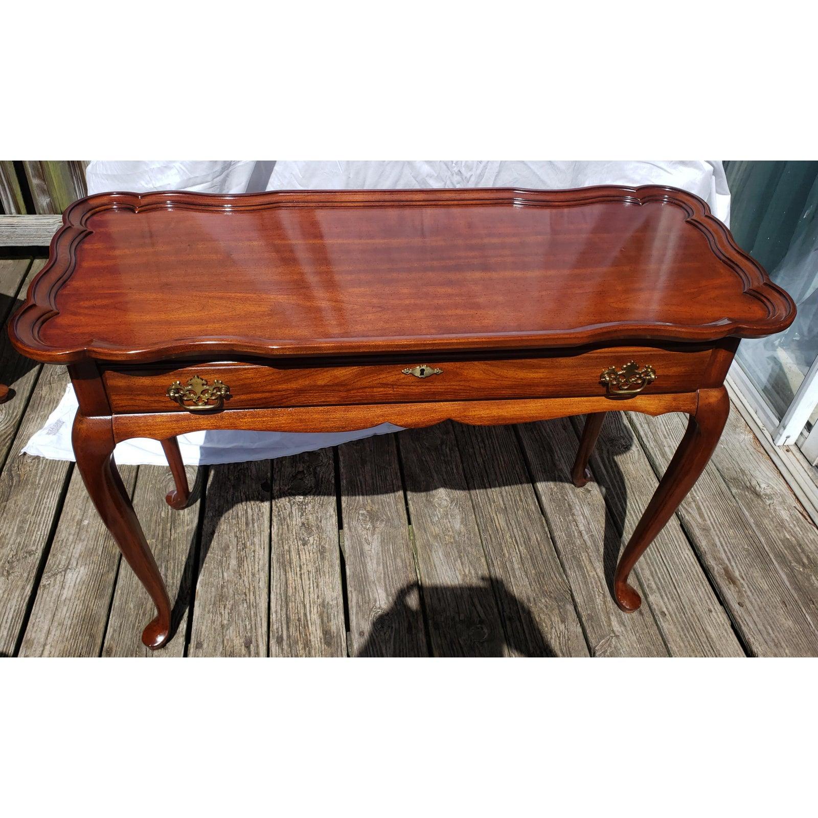 1970s Superior Furniture scallop edge console table in solid walnut wood. Rare to find. Table in good vintage condition with some signs of use. Measurements are 39.5