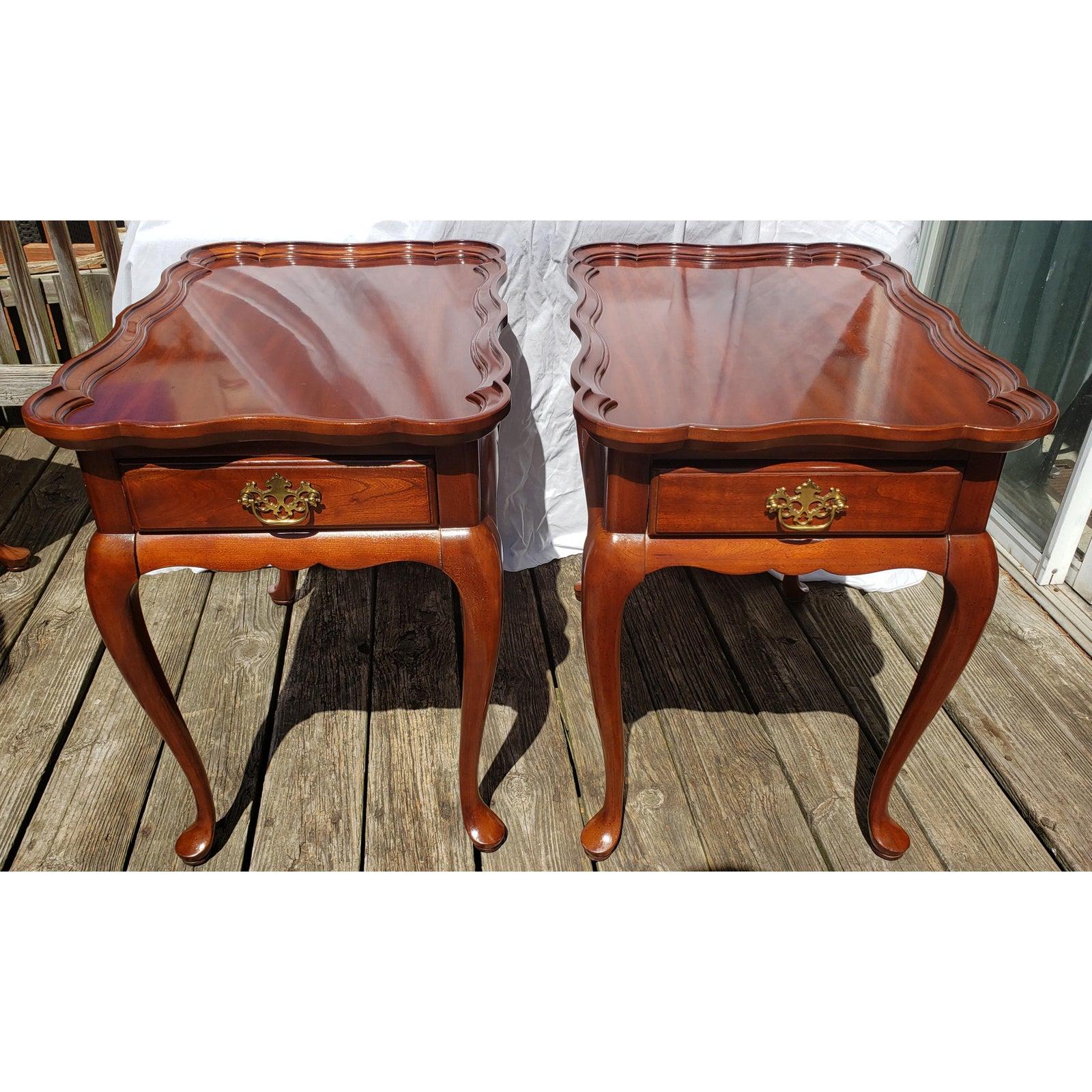 Pair of Superior Furniture solid walnut end table with scallop edge top.