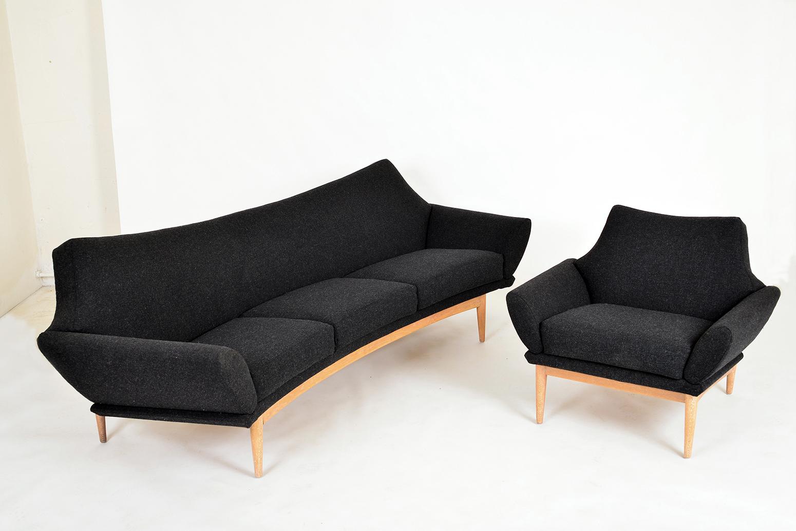 Rare, and seriously striking curved three-seat sofa and matching armchair designed in 1960 by Danish designer Johannes Andersen for little-known Swedish company Trensums.
This design is called the “Hollywood”, and features an organic limed oak