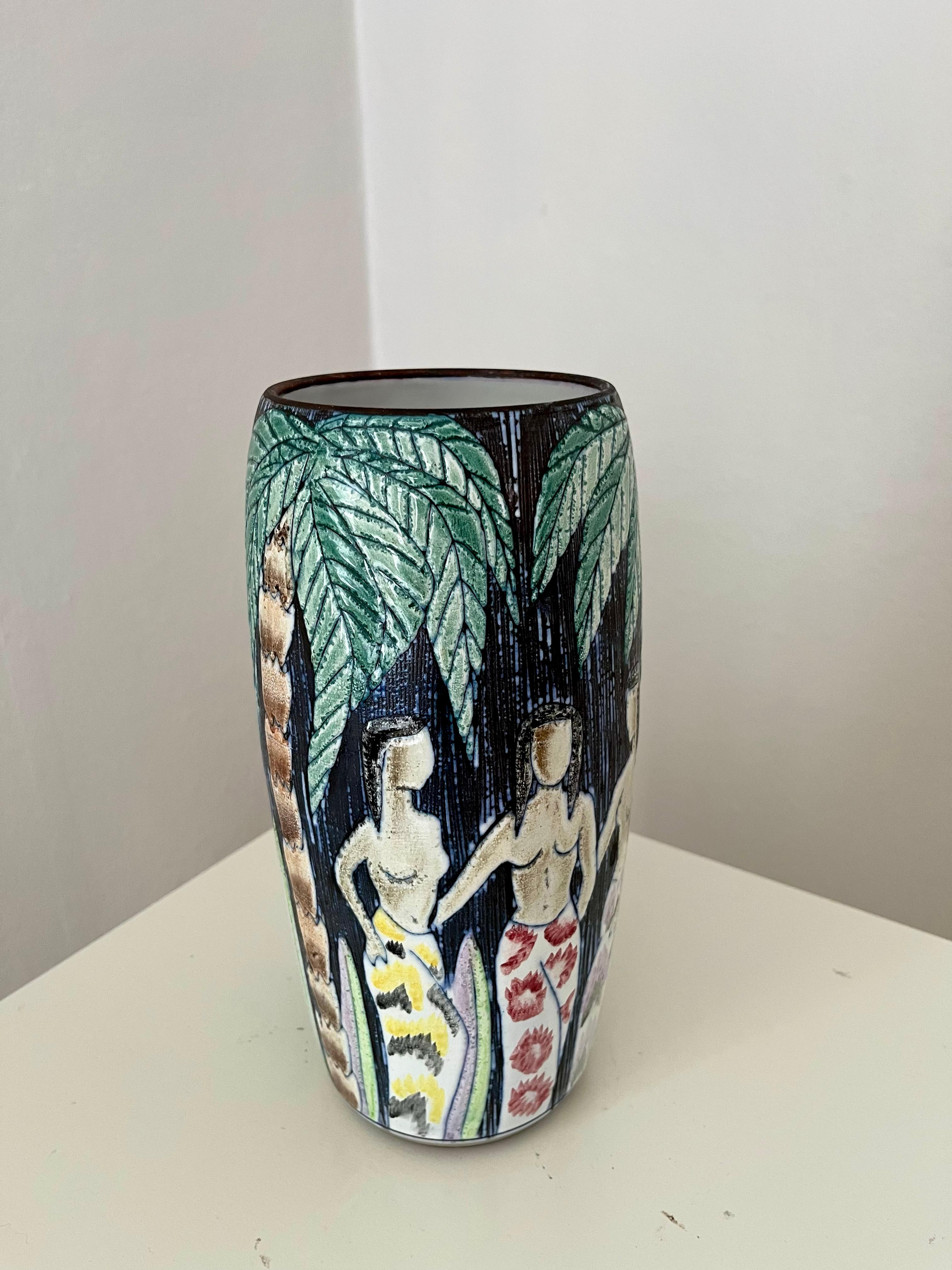 1960s Swedish hand decorated vase by Alingsås Ceramic with palm, flowers & women. Highly decorated and detailed in pleasing to the eyes nuances of green, white, pink, yellow, purple and red. 

Handmade and decorated with the sgraffito technique that