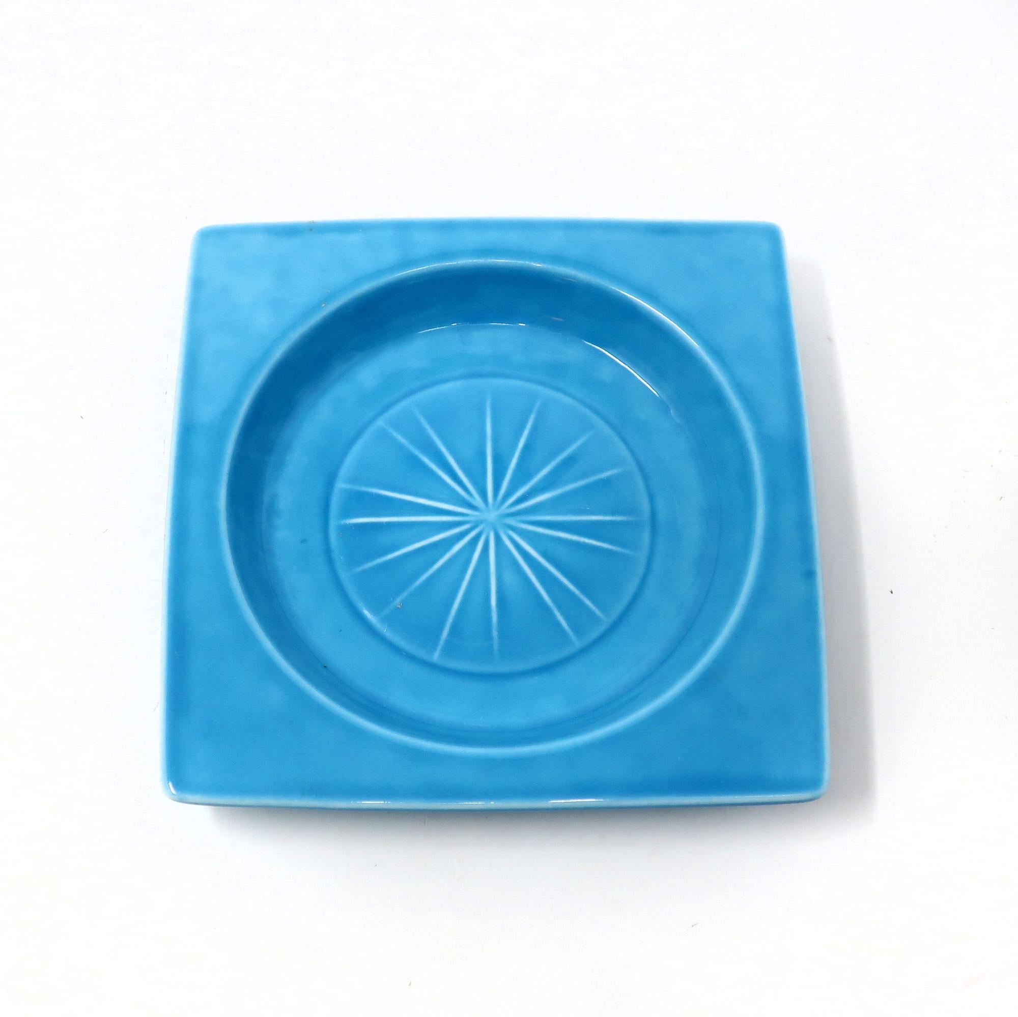 Attributed to Carl Harry Stalhane, this dish by Rorstrand Sweden is the epitome of 1960s Swedish Modern design. Glazed in blue with a light blue starburst pattern, it is the perfect size to use as an ashtray, ceramic catchall, or as a wine