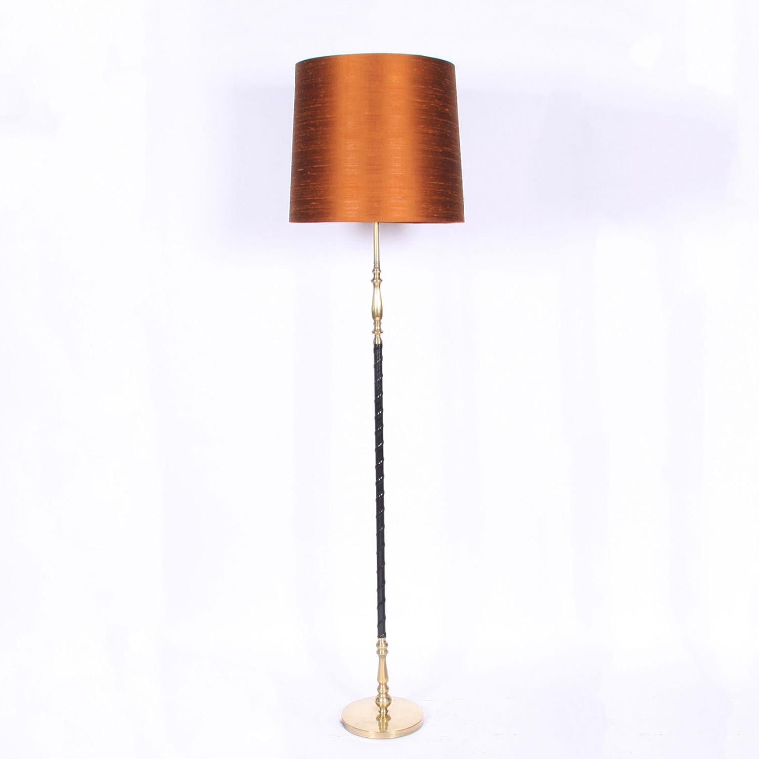Swedish, circa 1960

A stylish pair of brass and leather Swedish floor lamps. 

Rewired and PAT tested. 

Pictured with a pair of bespoke, hand made, silk shades in a burnt orange shade.