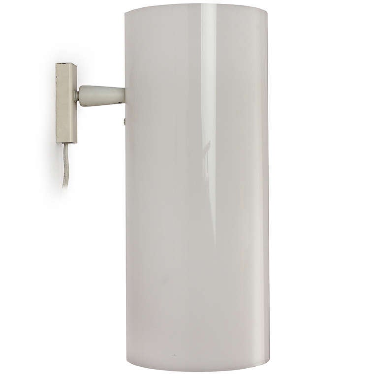 An elegant and useful pair of cylindrical wall sconces simply executed in translucent Perspex and lacquered steel.