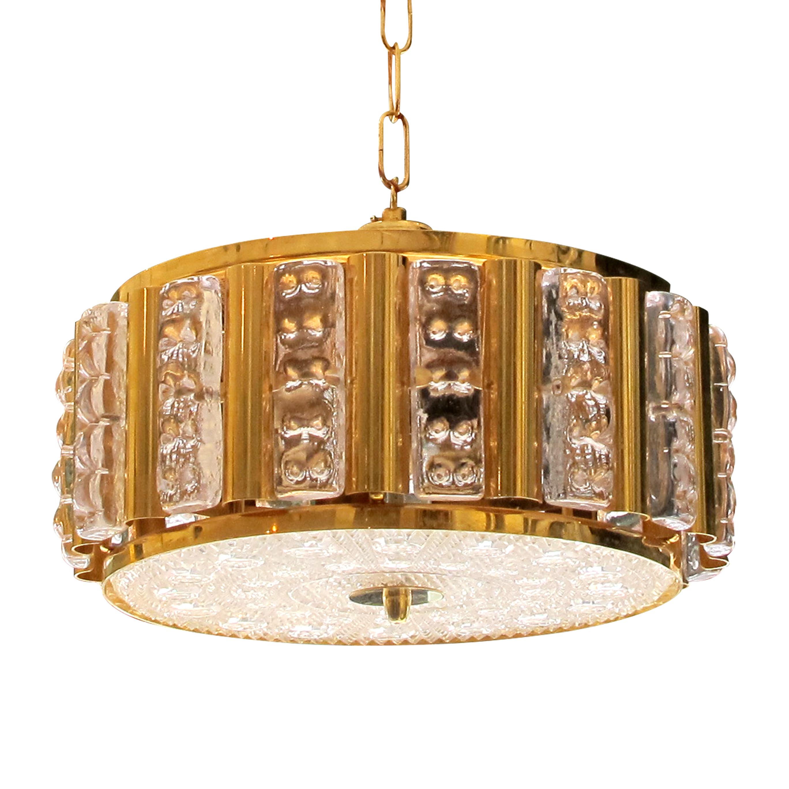 1960s glass and brass ceiling light designed by Carl Fagerlund and manufactured by Orrefors in Sweden. This elegant light is in great condition and offers a warm glowing light ideal for over a dining table, centre of a living/dining room or kitchen